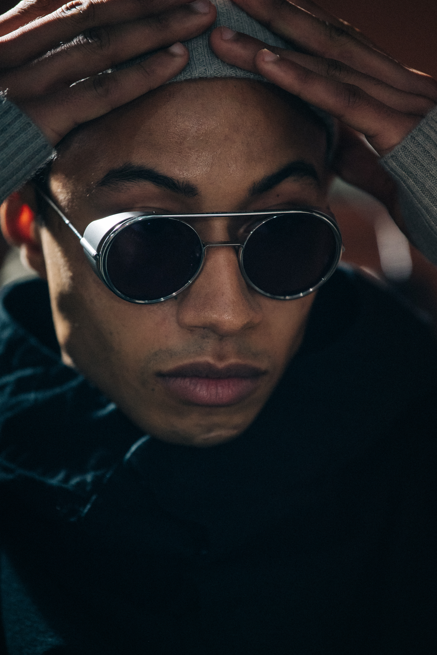 Model wearing grey beanie