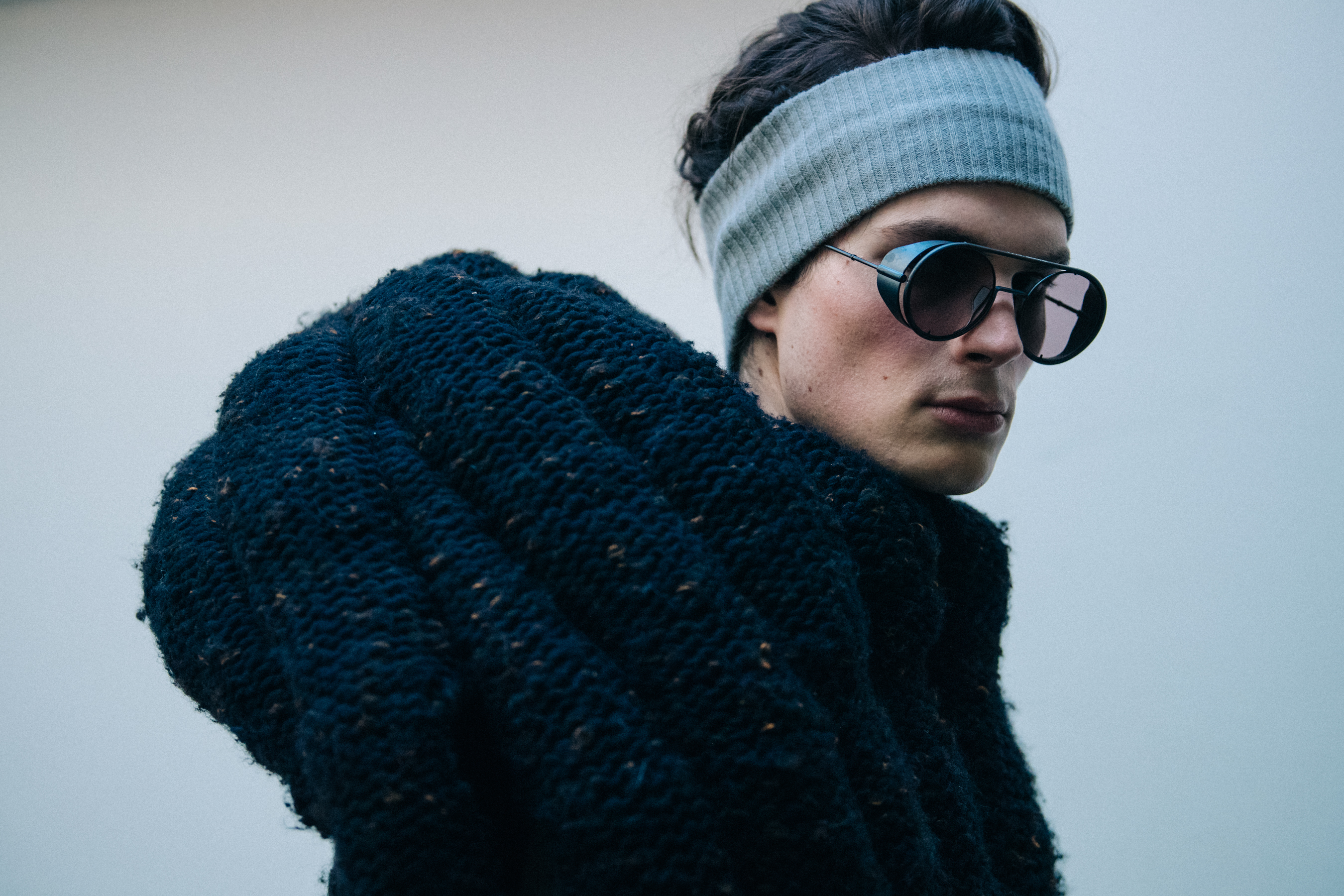 Model wearing grey knit jumper