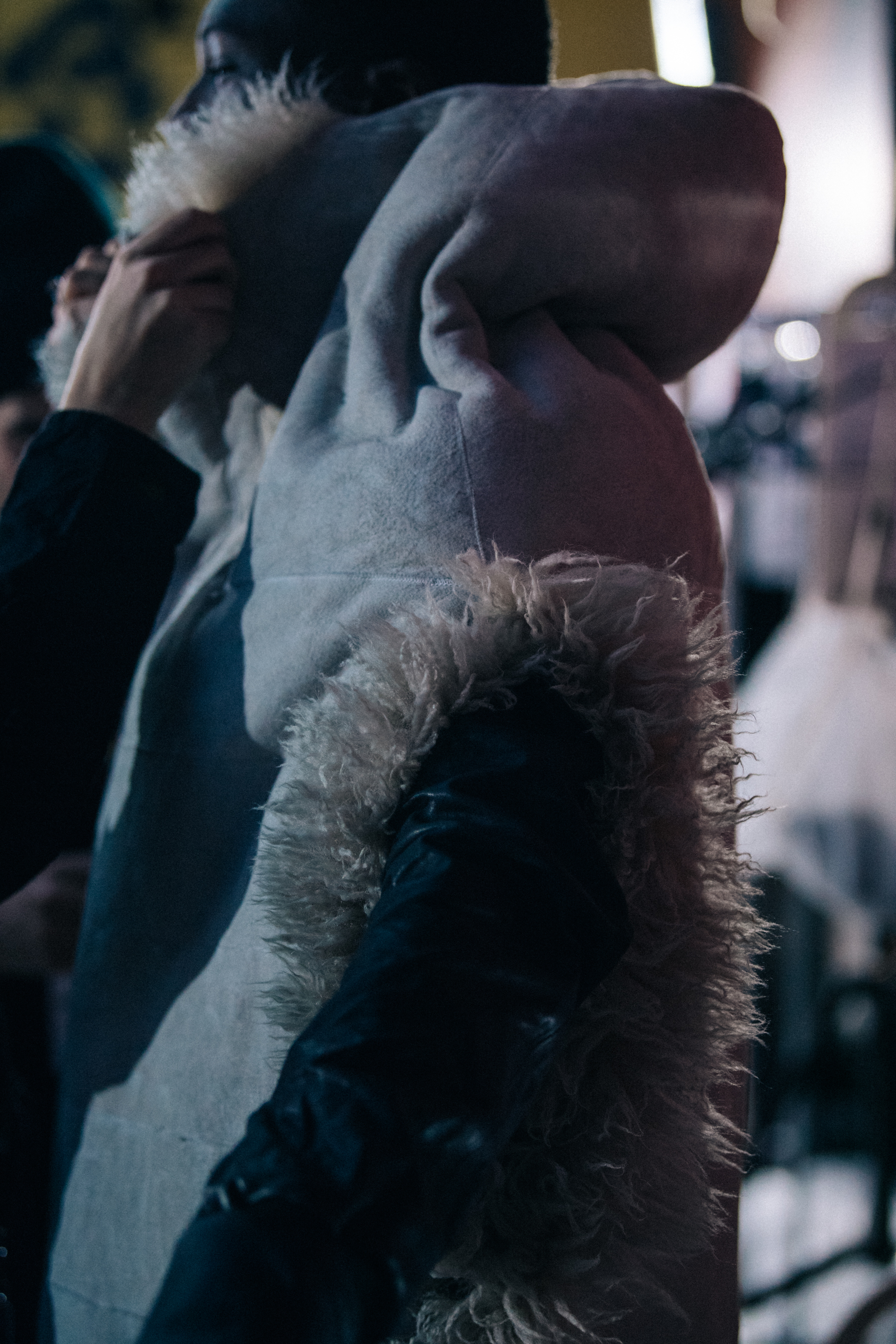Model wearing fur gilet backstage