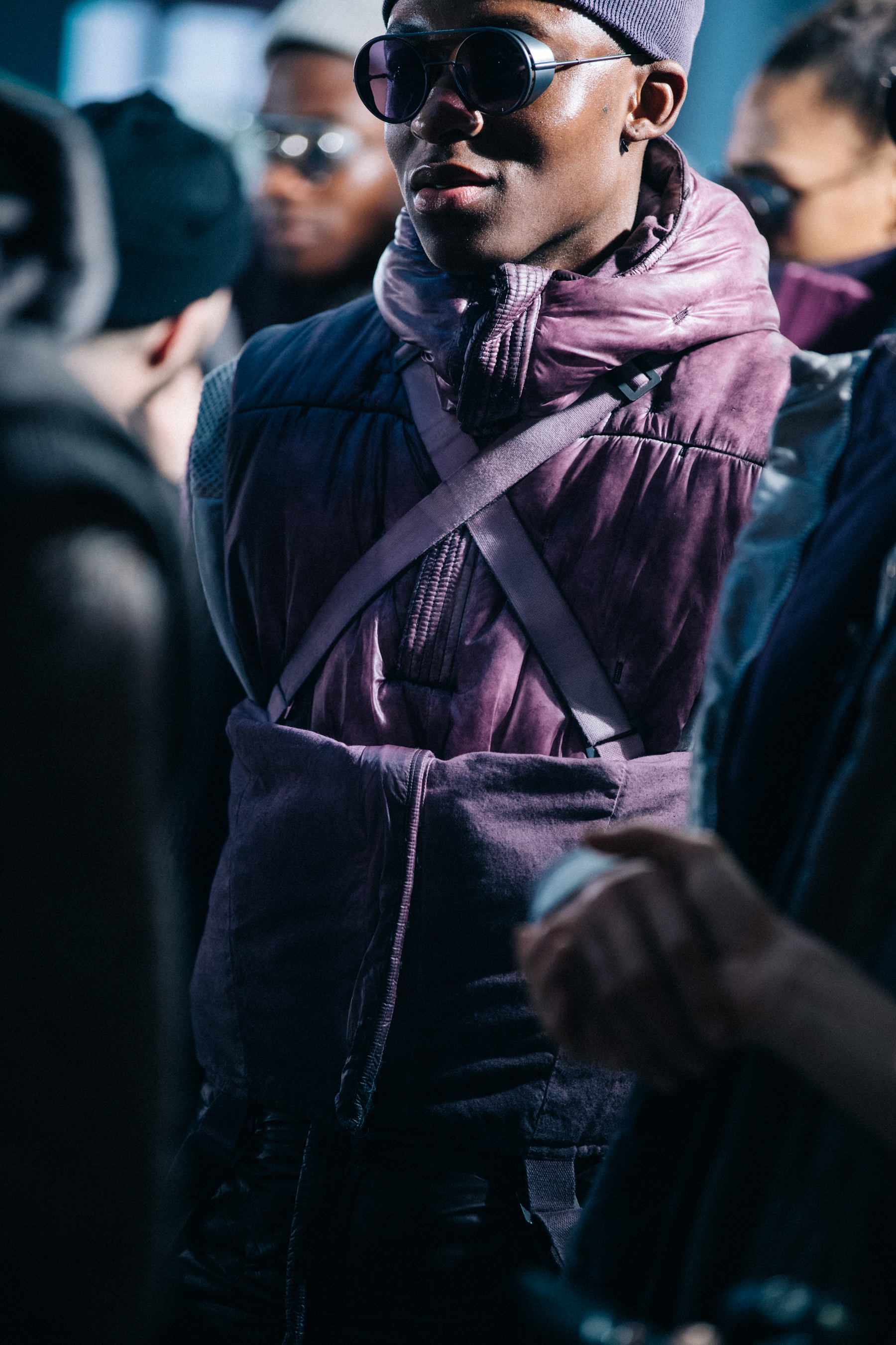 Models wearing grey and purple backstage