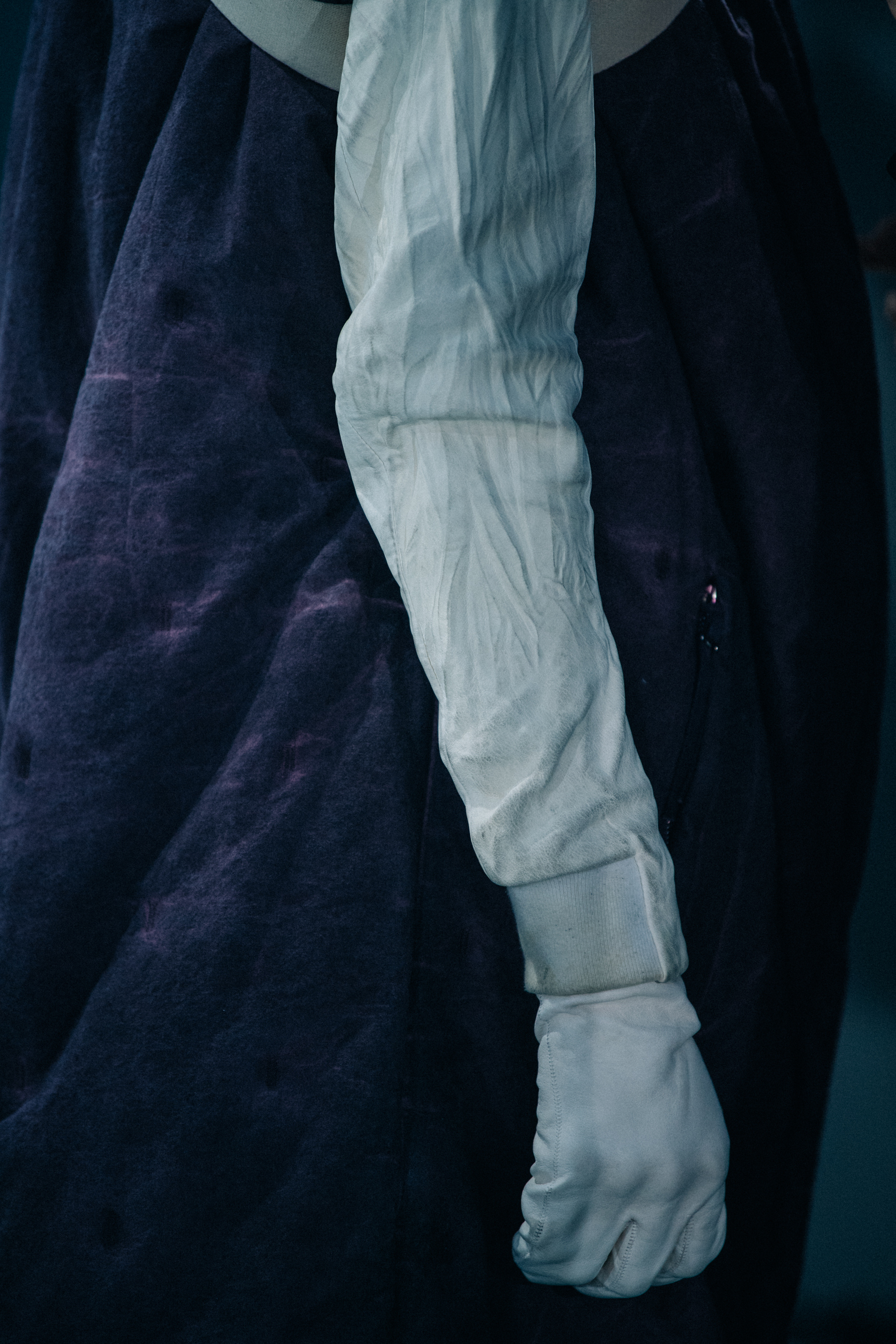 Model wearing long white gloves