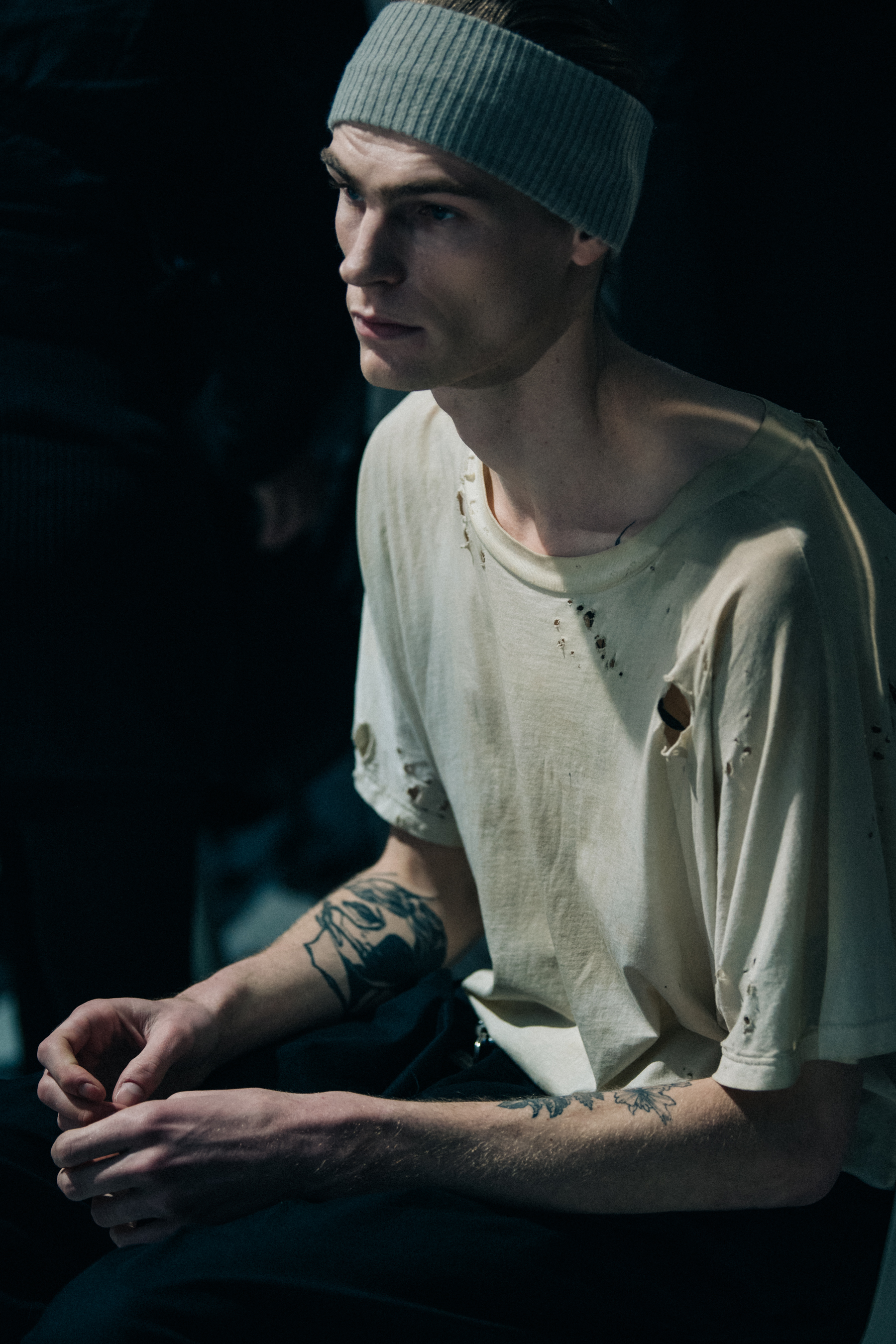 Model wearing ripped tee shirt
