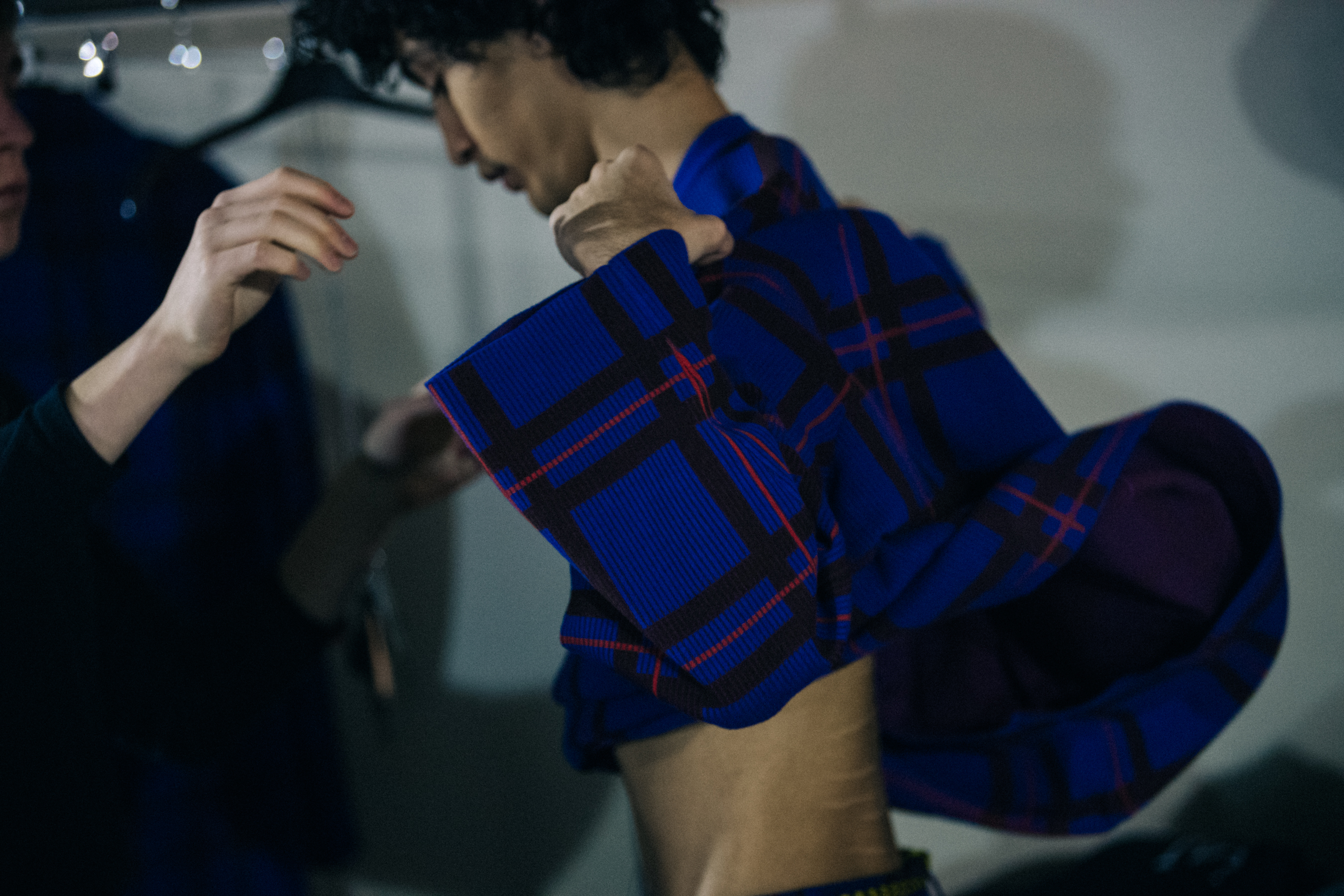 Model dressing in blue check