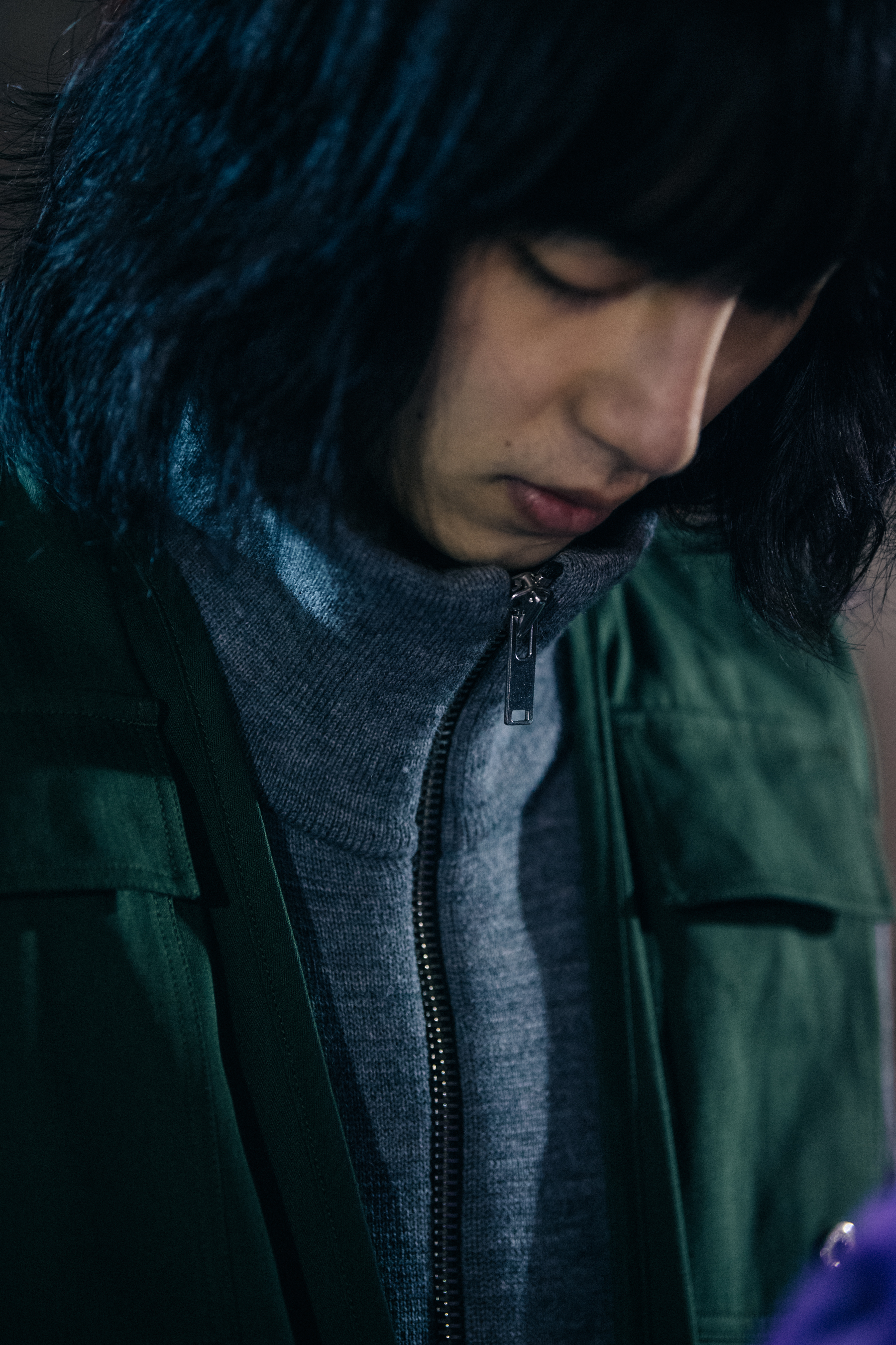 Model wearing grey and green at Etudes Studio