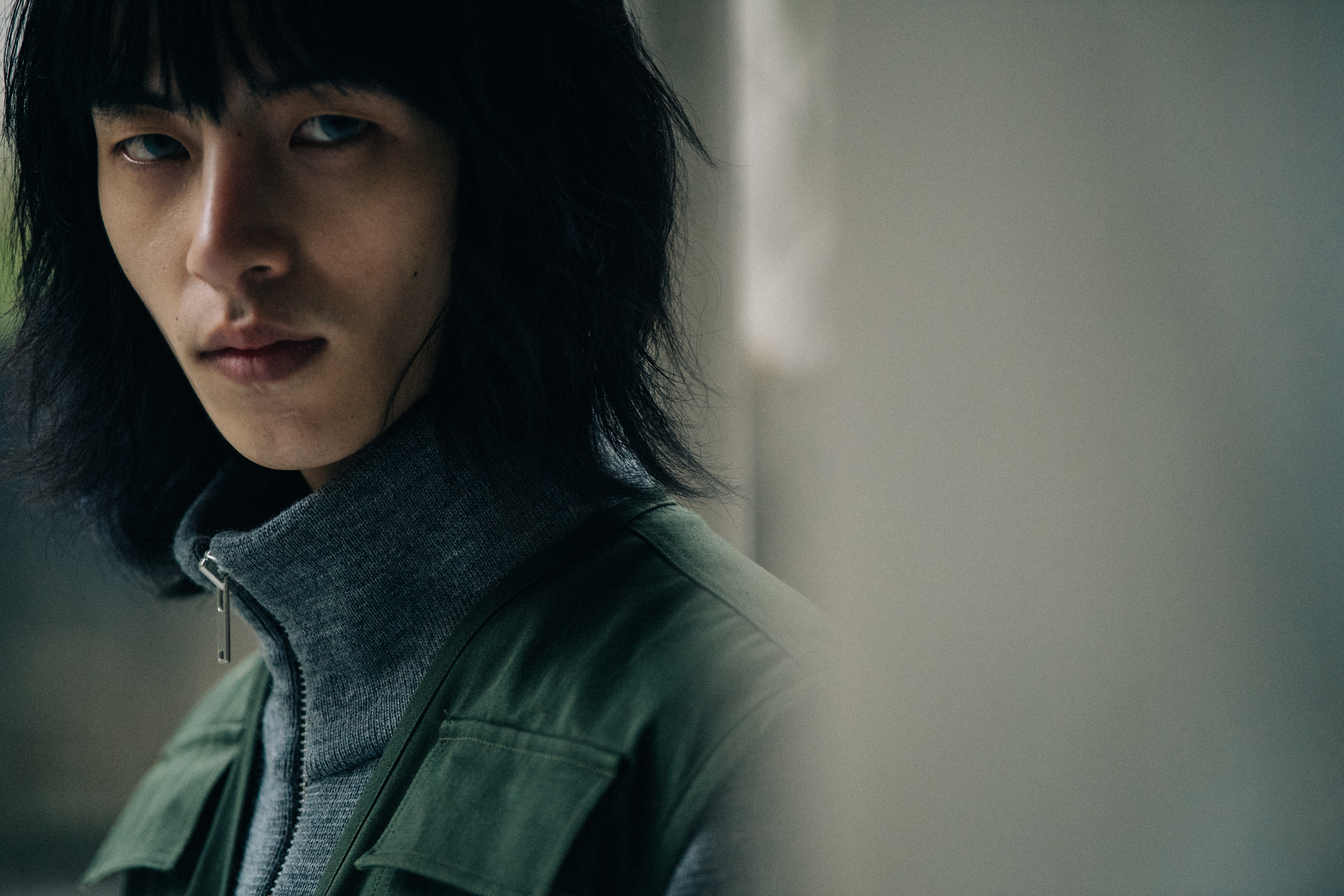 Model wearing grey and green at Etudes Studio
