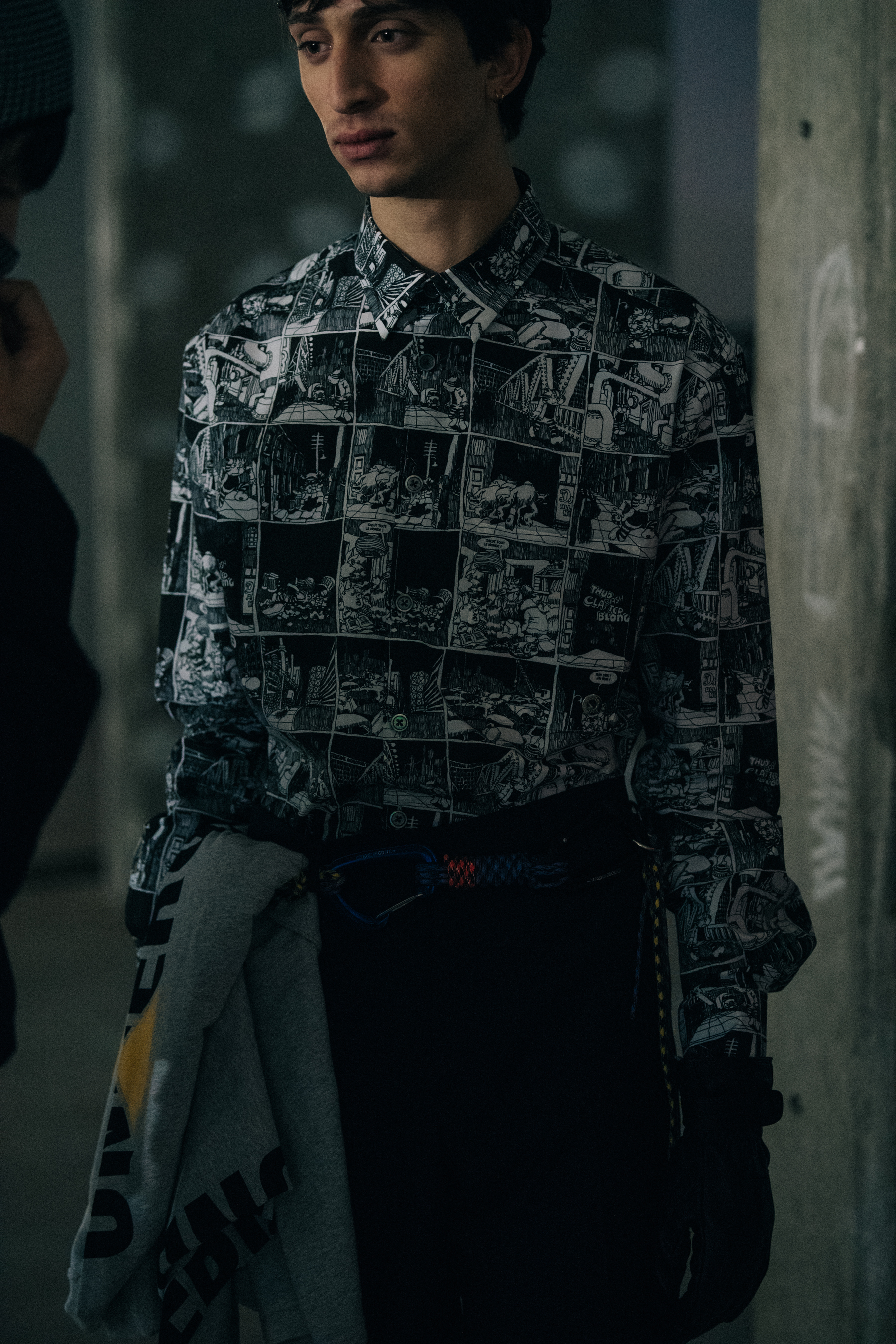 Model wearing printed graphic shirt