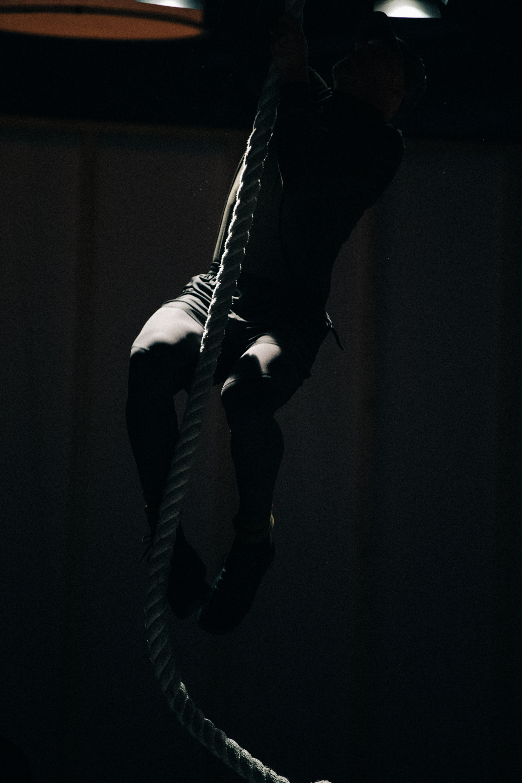 Man climbing rope at HALO show