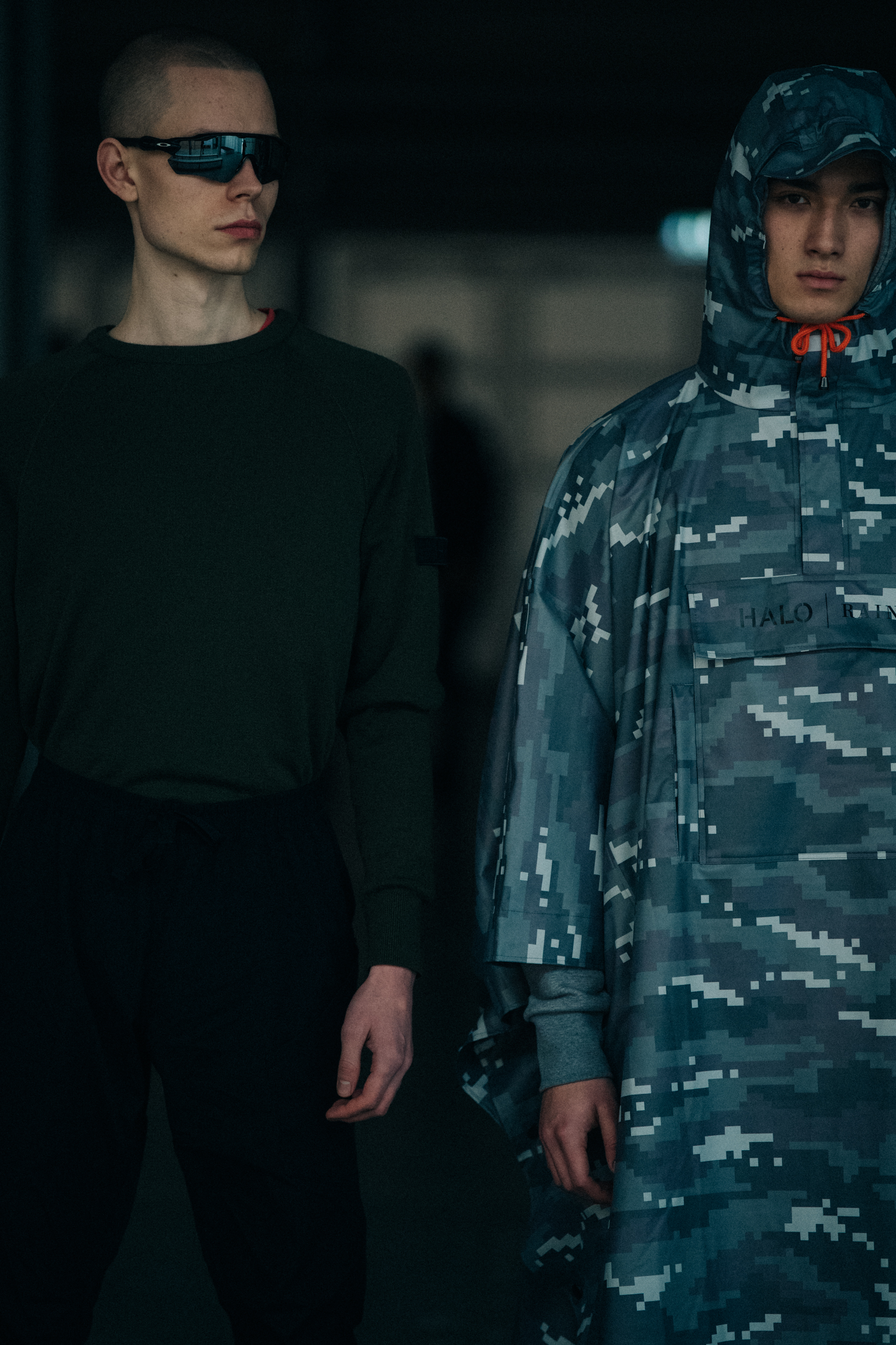 Model wearing grey digital camouflage backstage