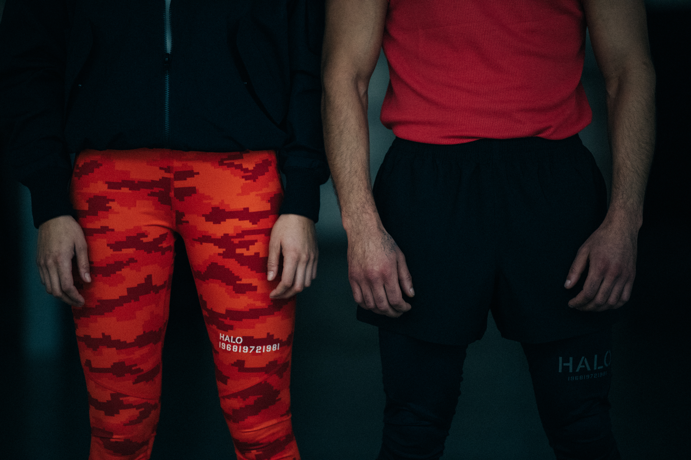 Two models wearing orange HALO activewear
