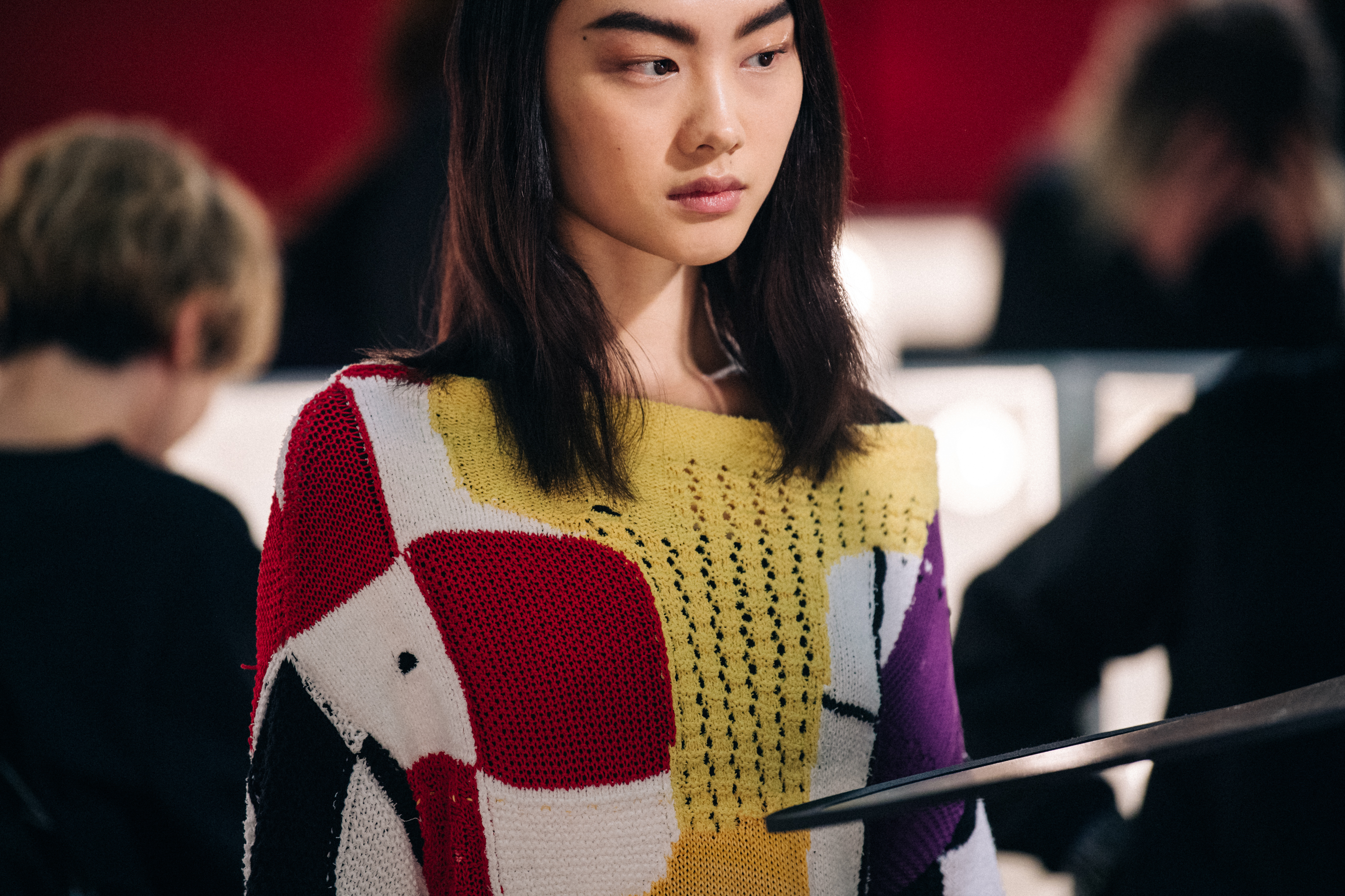 Asian model wearing colourful JW Anderson knit