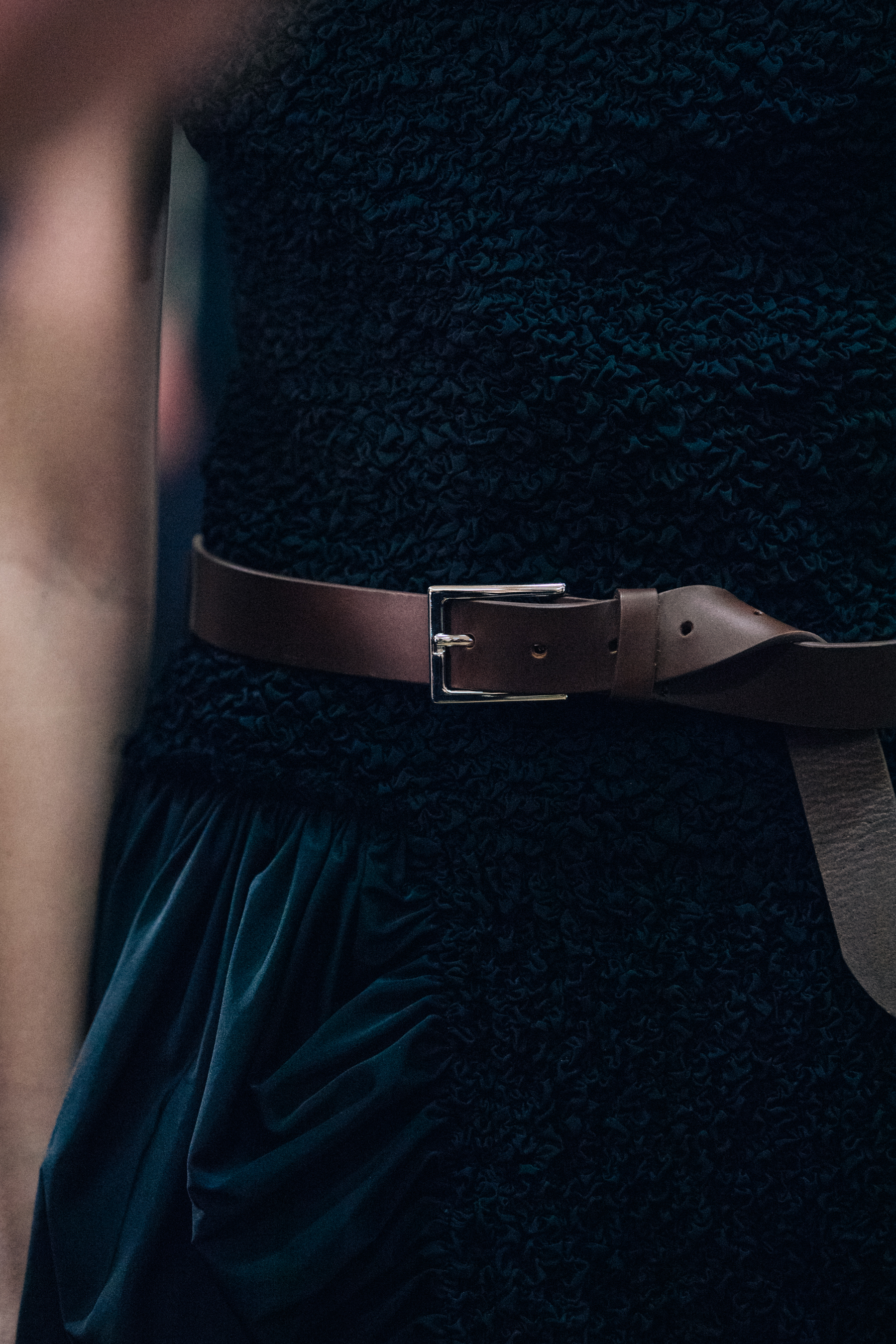 Model wearing black dress at JW Anderson