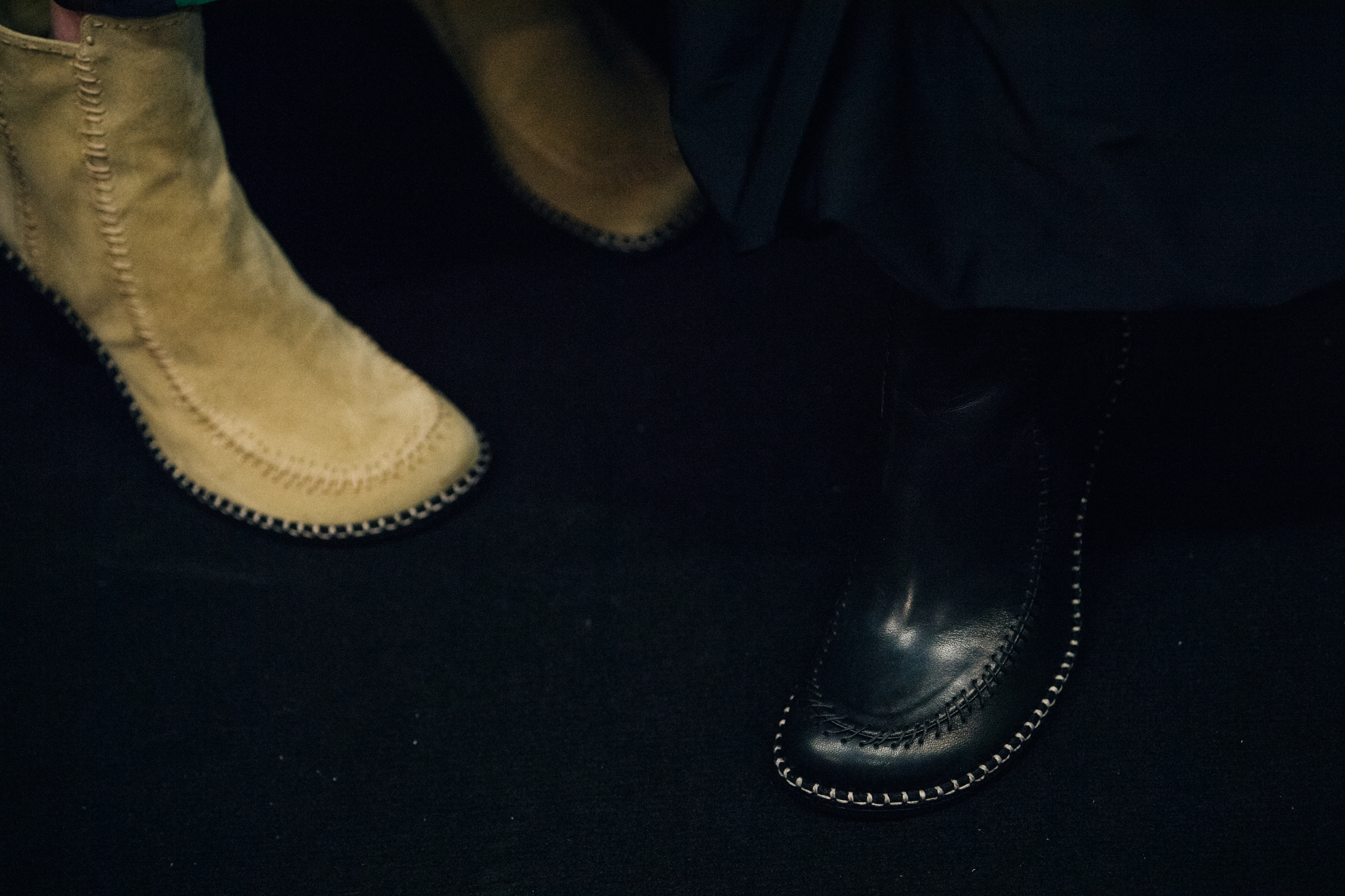 Models wearing leather JW Anderson shoes