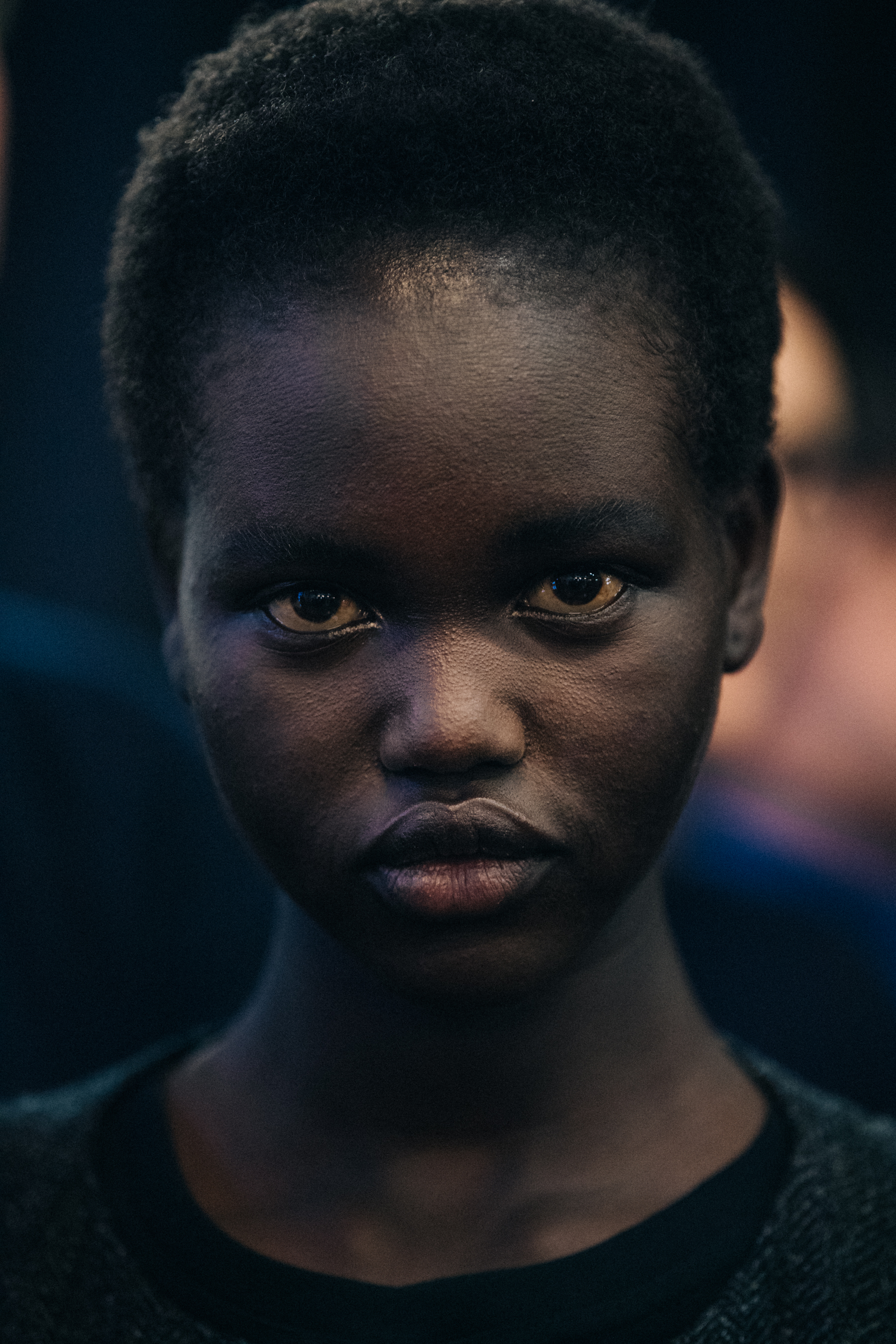 Portrait of Adut Akech backstage at JW Anderson