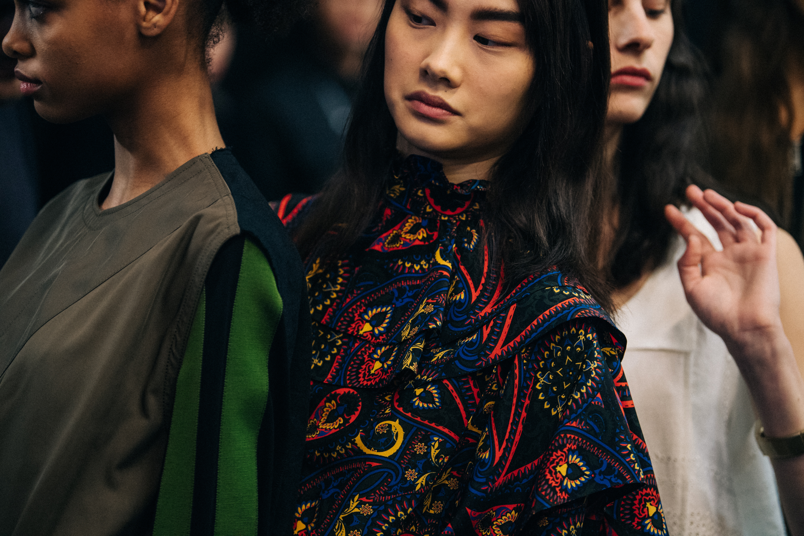 Asian model wearing colourful JW Anderson shirt