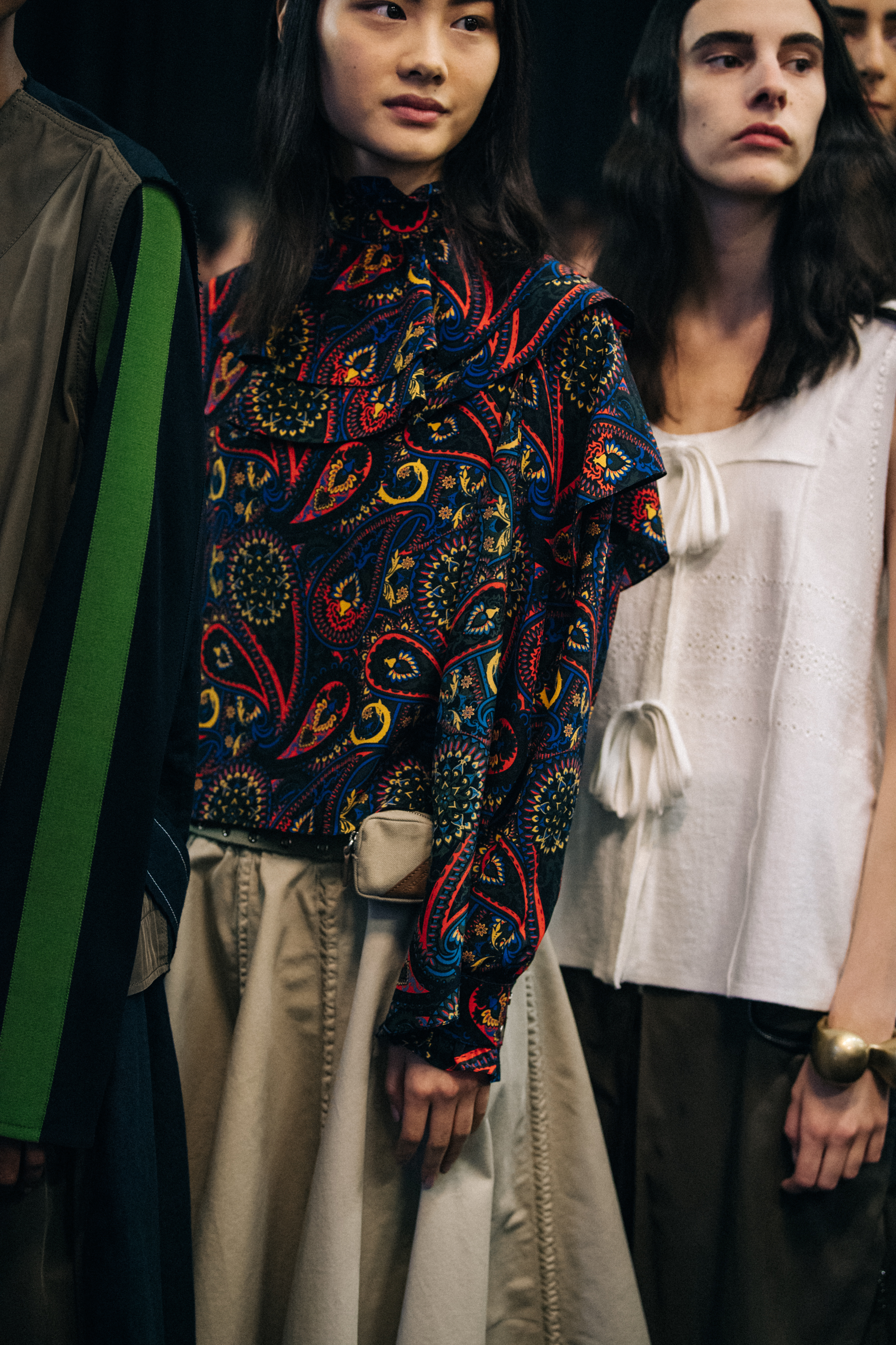 Asian model wearing colourful JW Anderson shirt