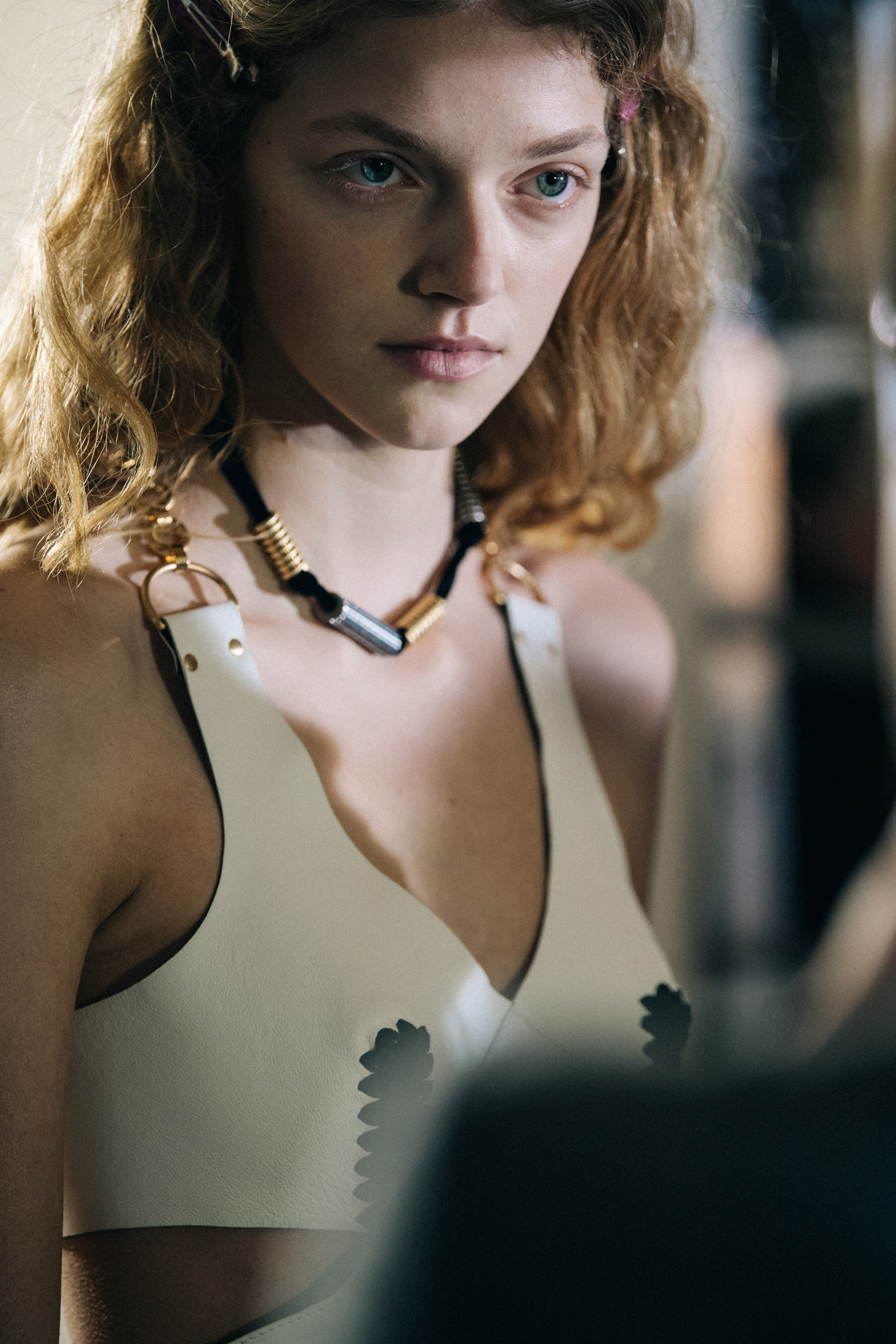 Model wearing white leather dress