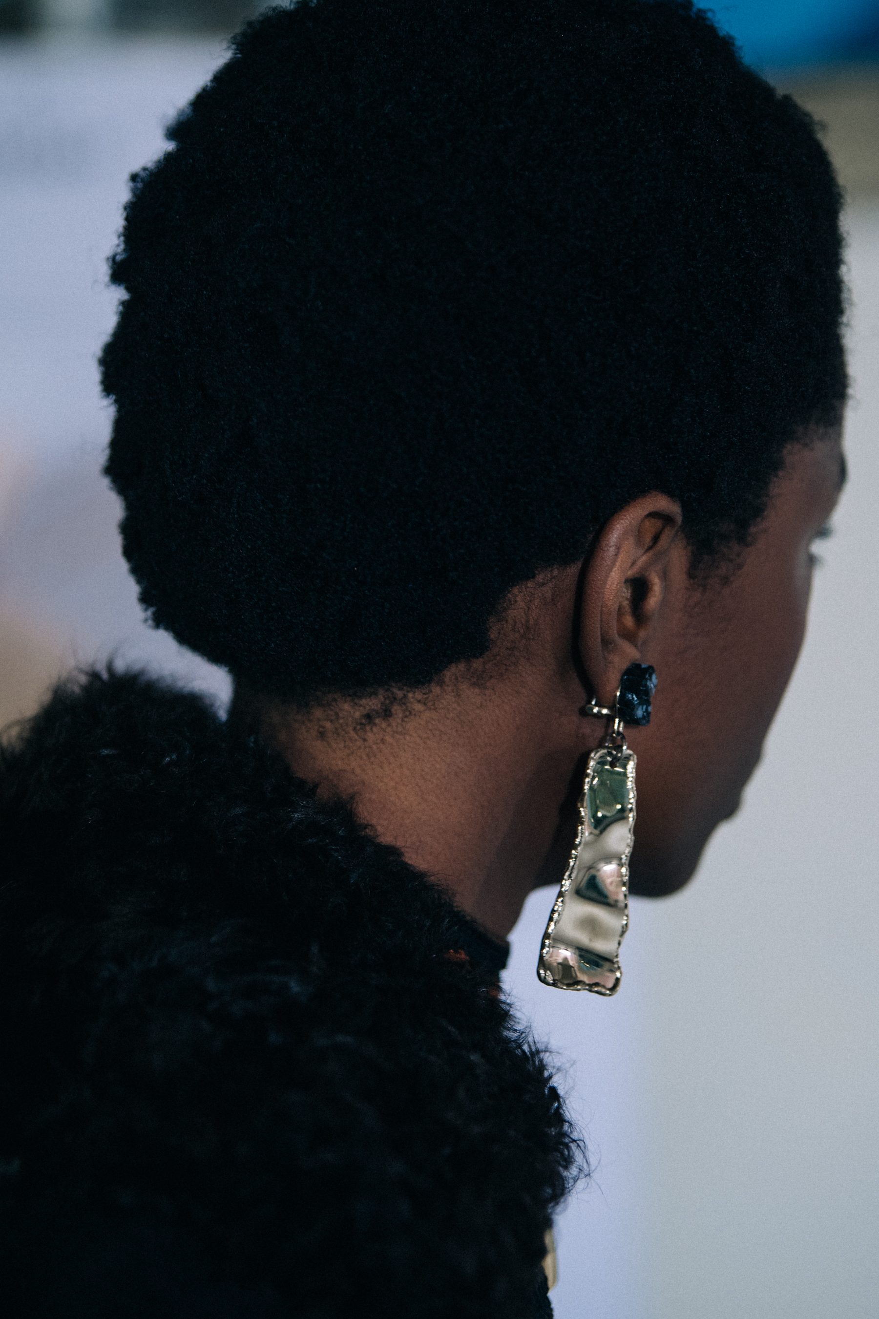 Model wearing silver earrings