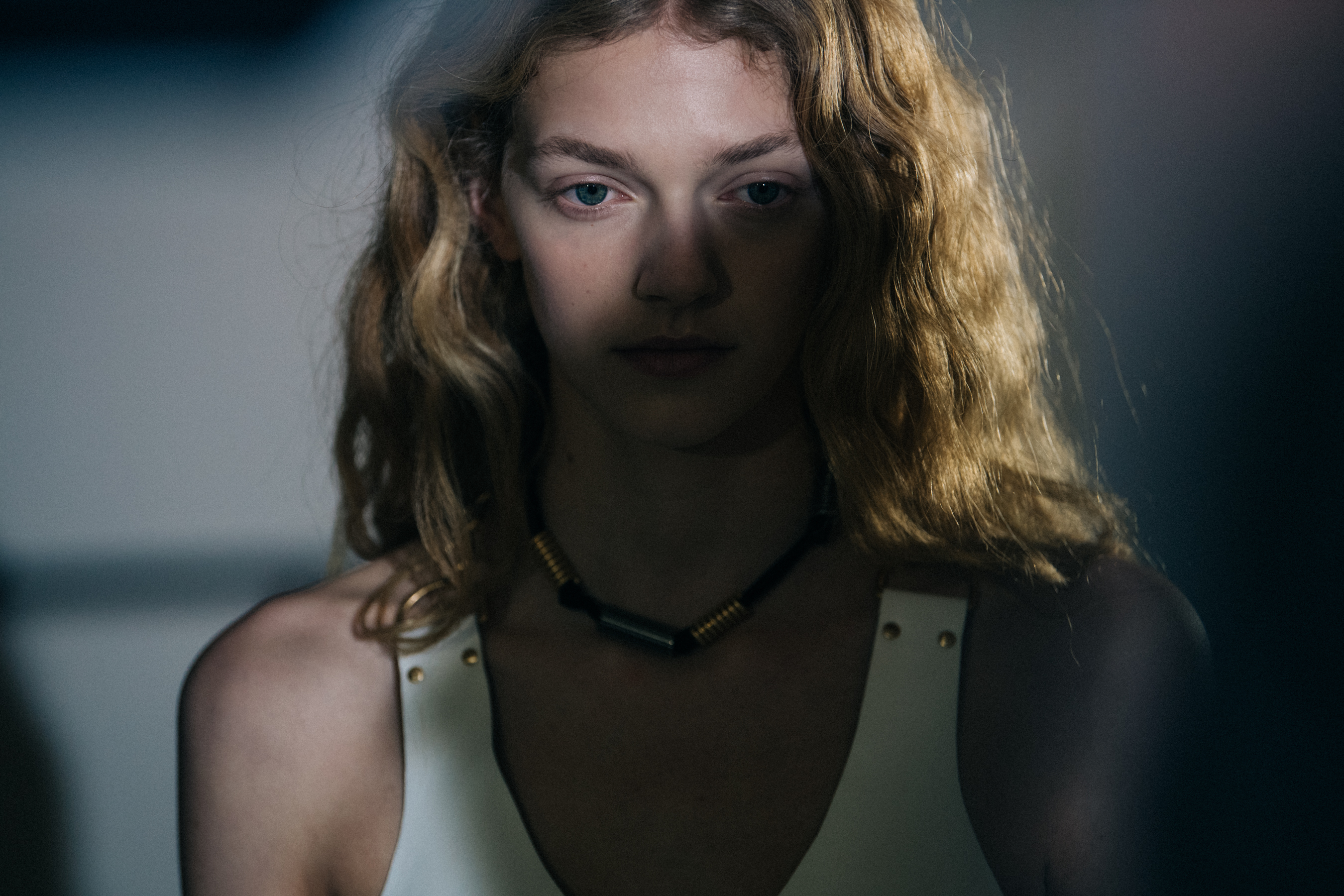Model wearing white leather dress
