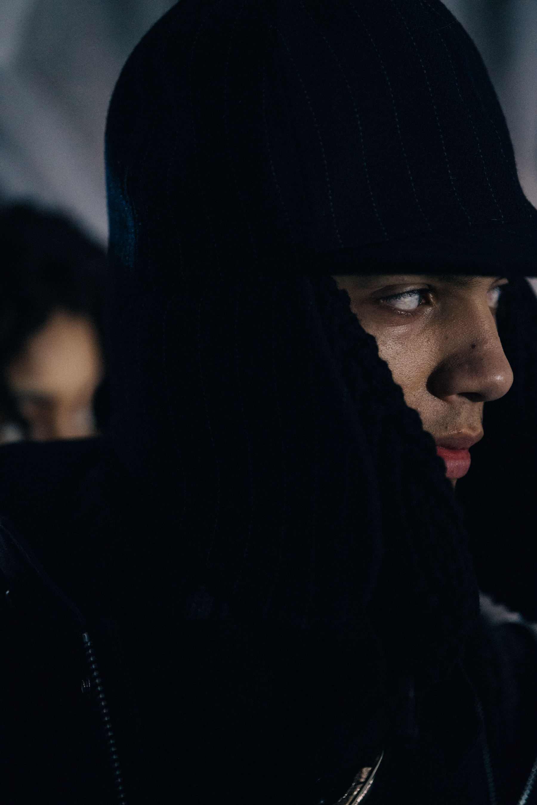 Model wearing black winter hat