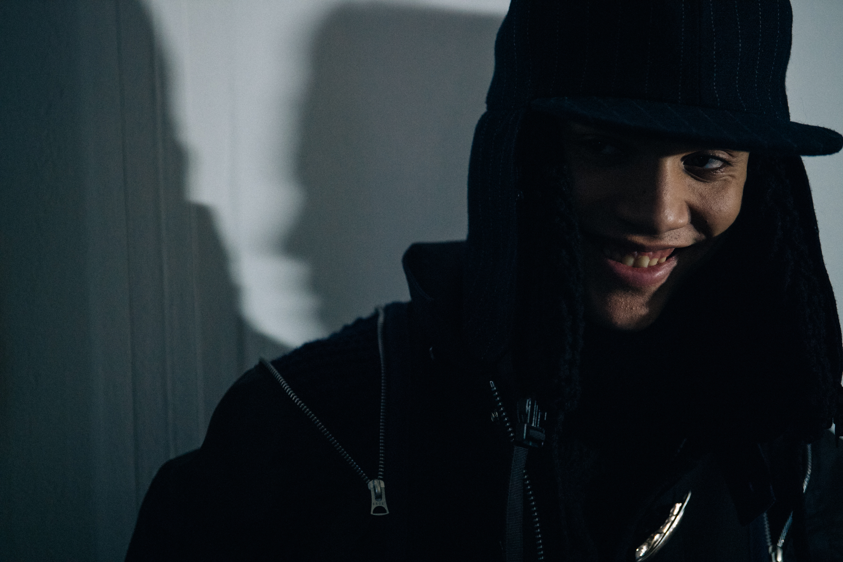 Model wearing black winter hat