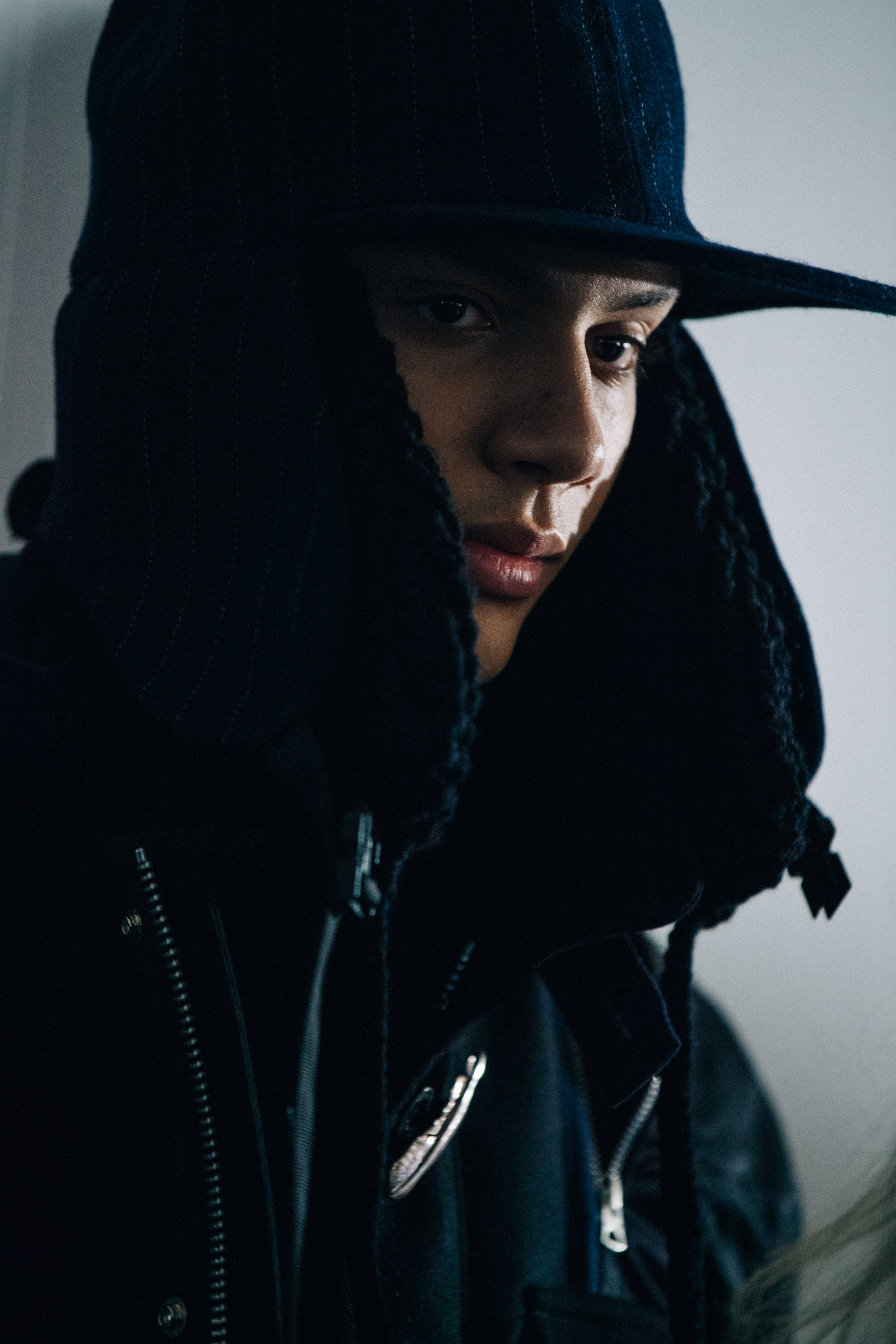 Model wearing black winter hat