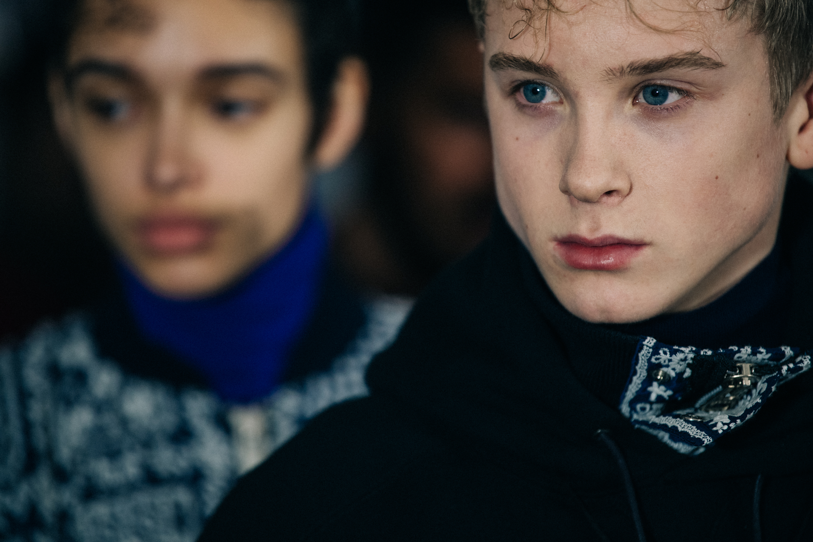 Model wearing black Sacai hoodie