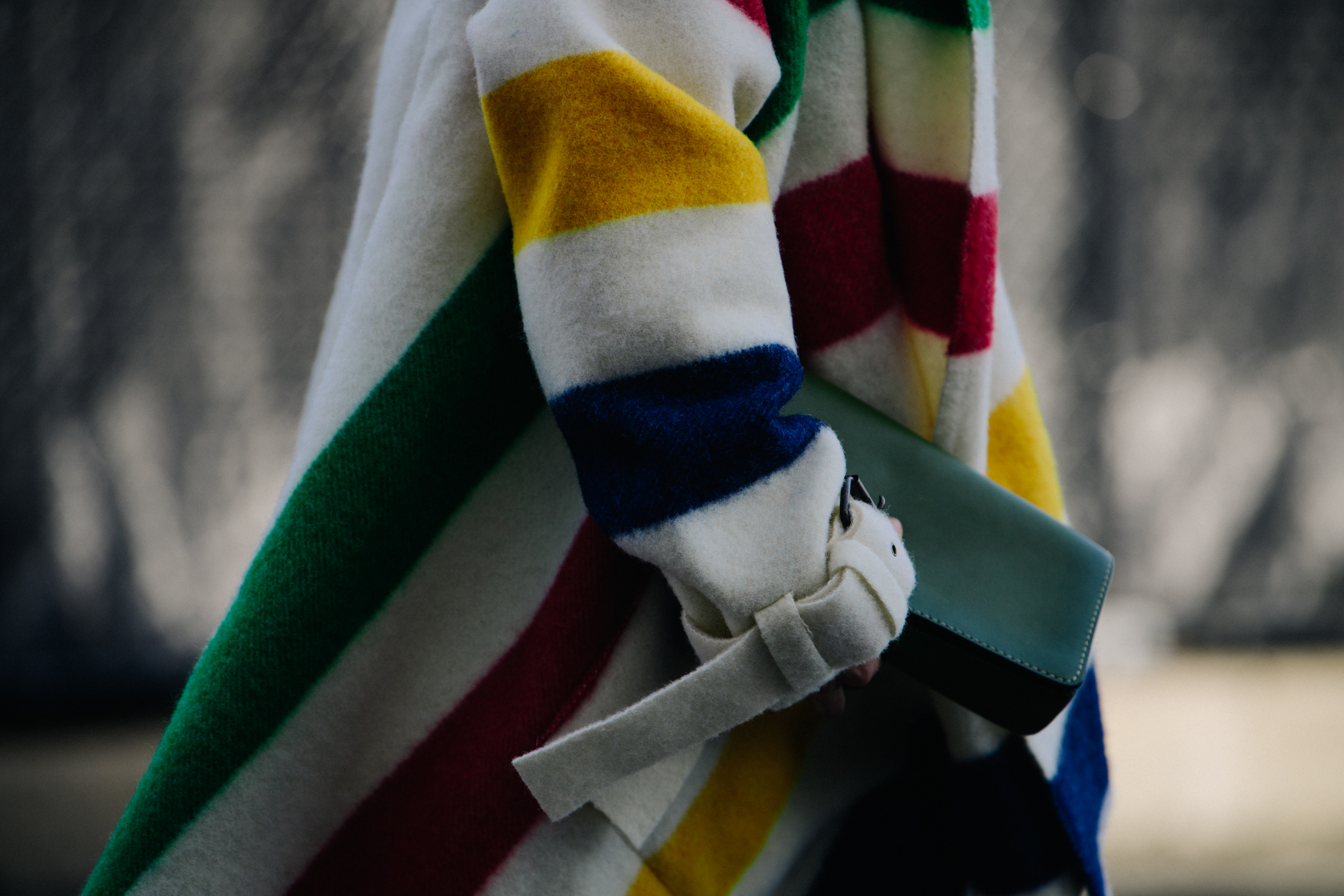 Woman wearing white striped coat
