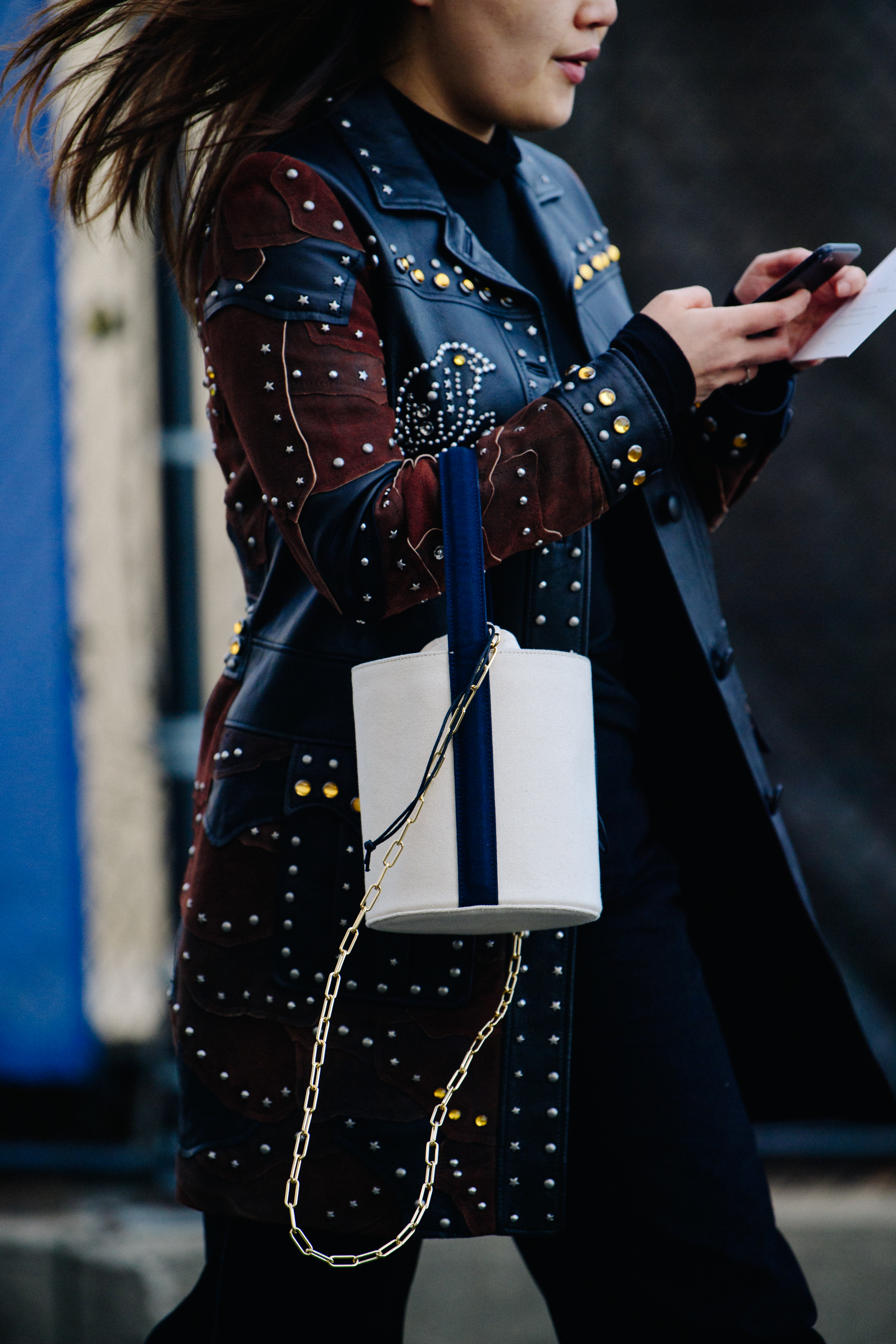 Woman wearing studded leather jacket