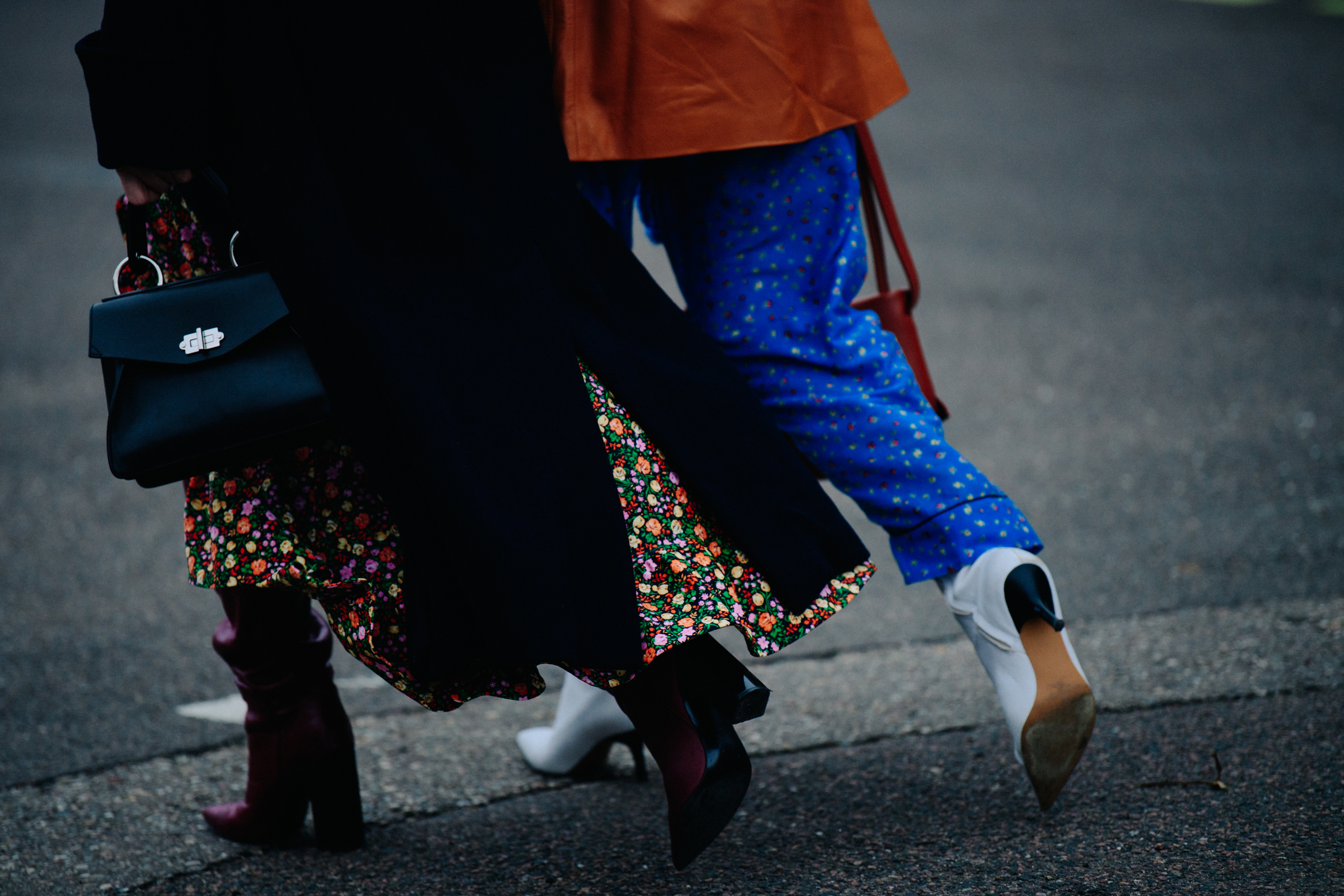 Two women wearing floral designs