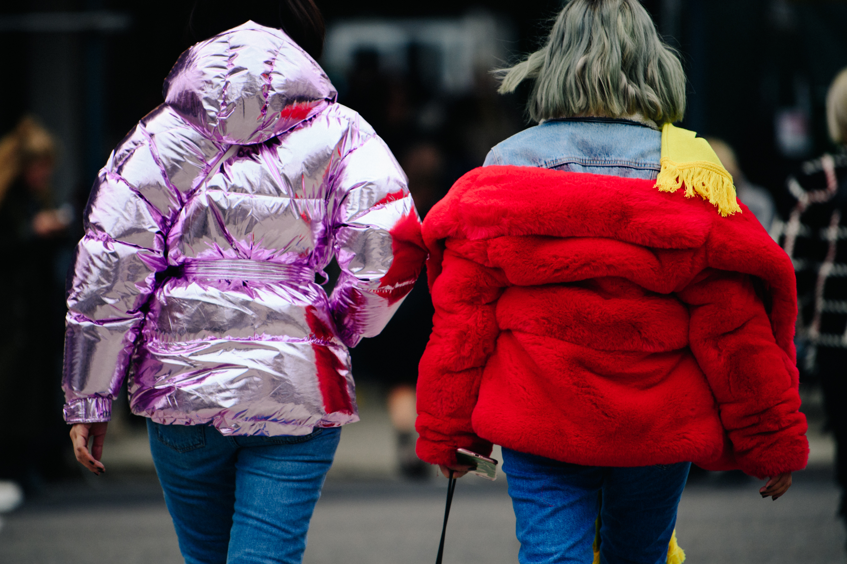 Two women wearing short colourful jackets