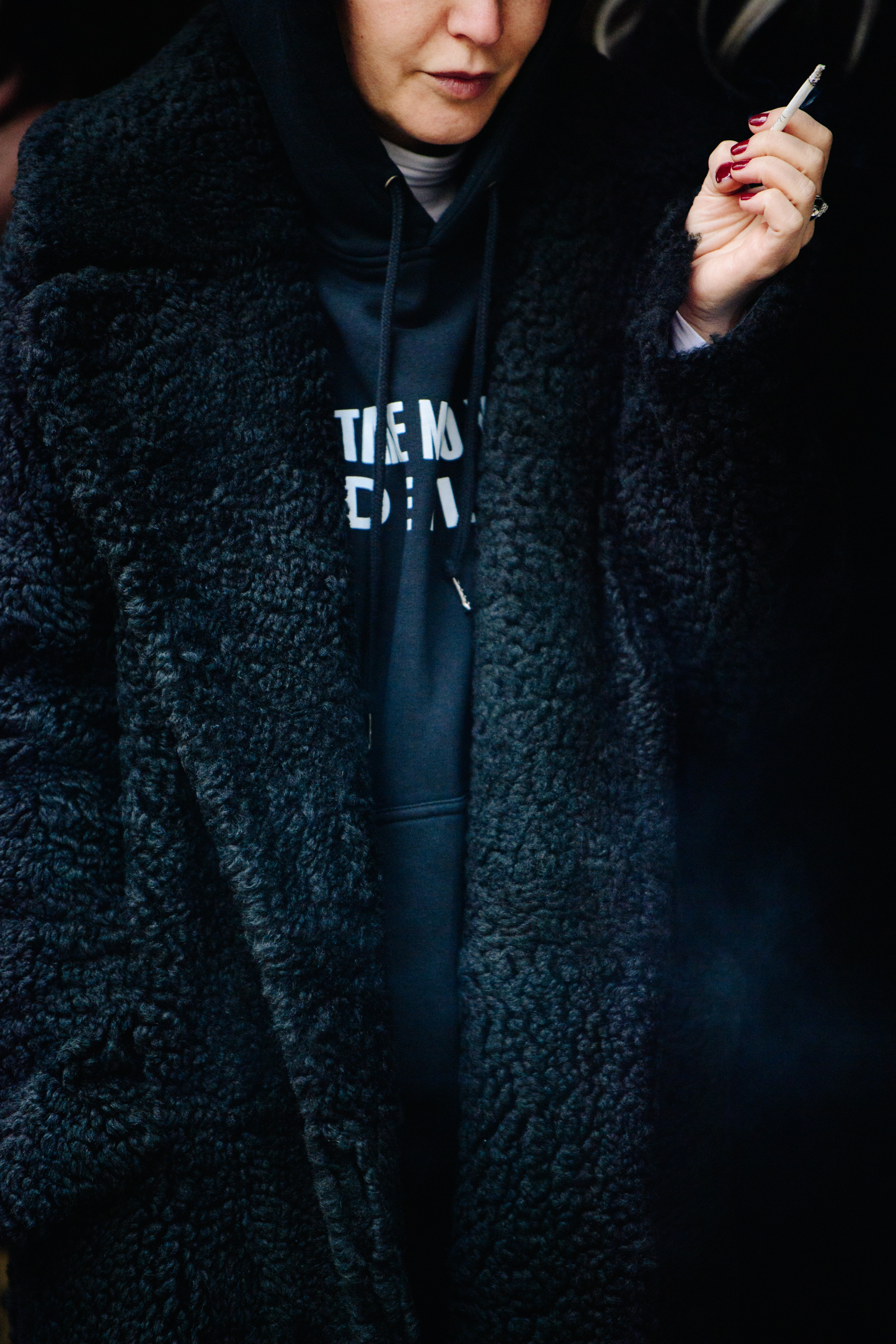 Woman wearing black fur coat
