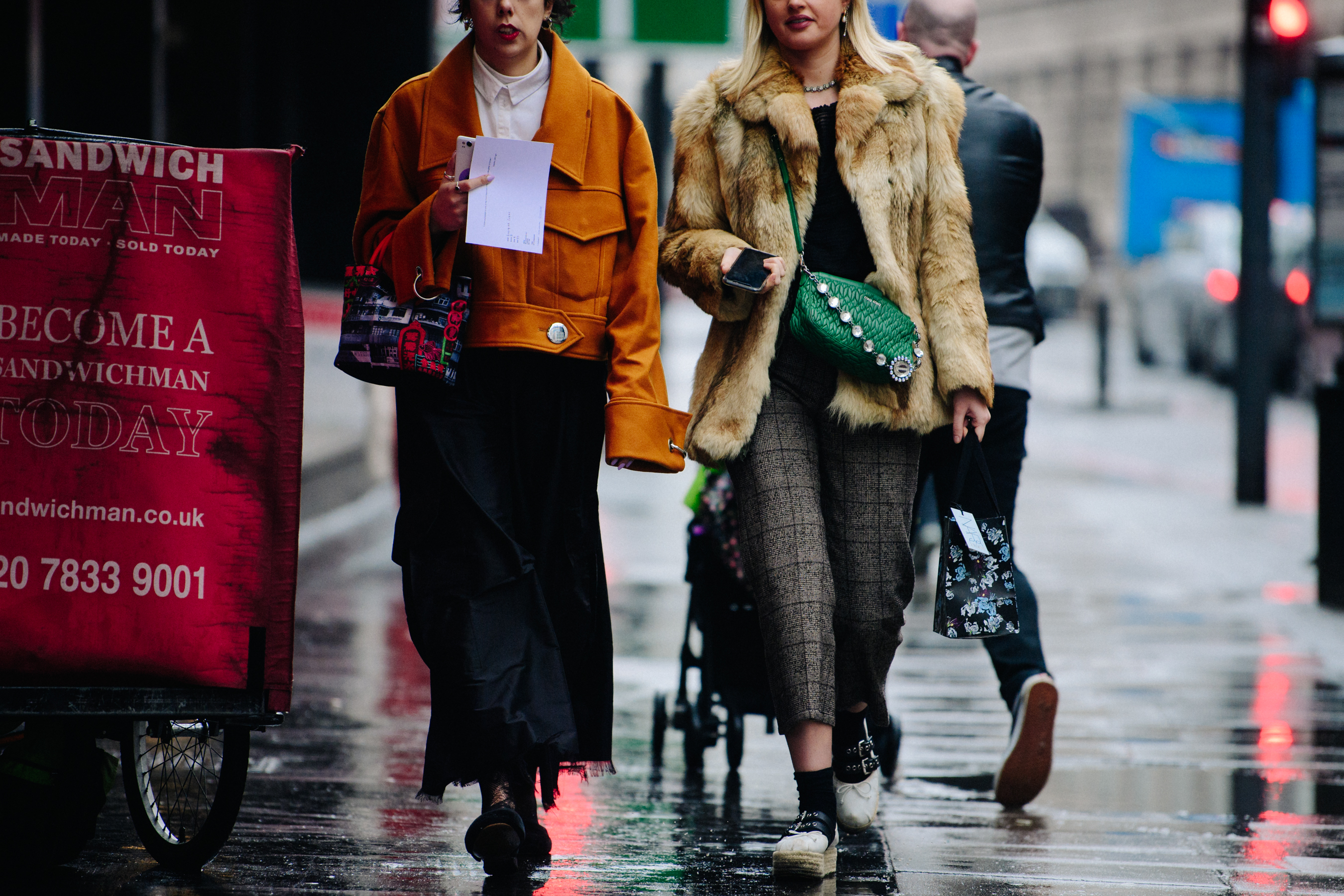 Two women wearing cropped jackets