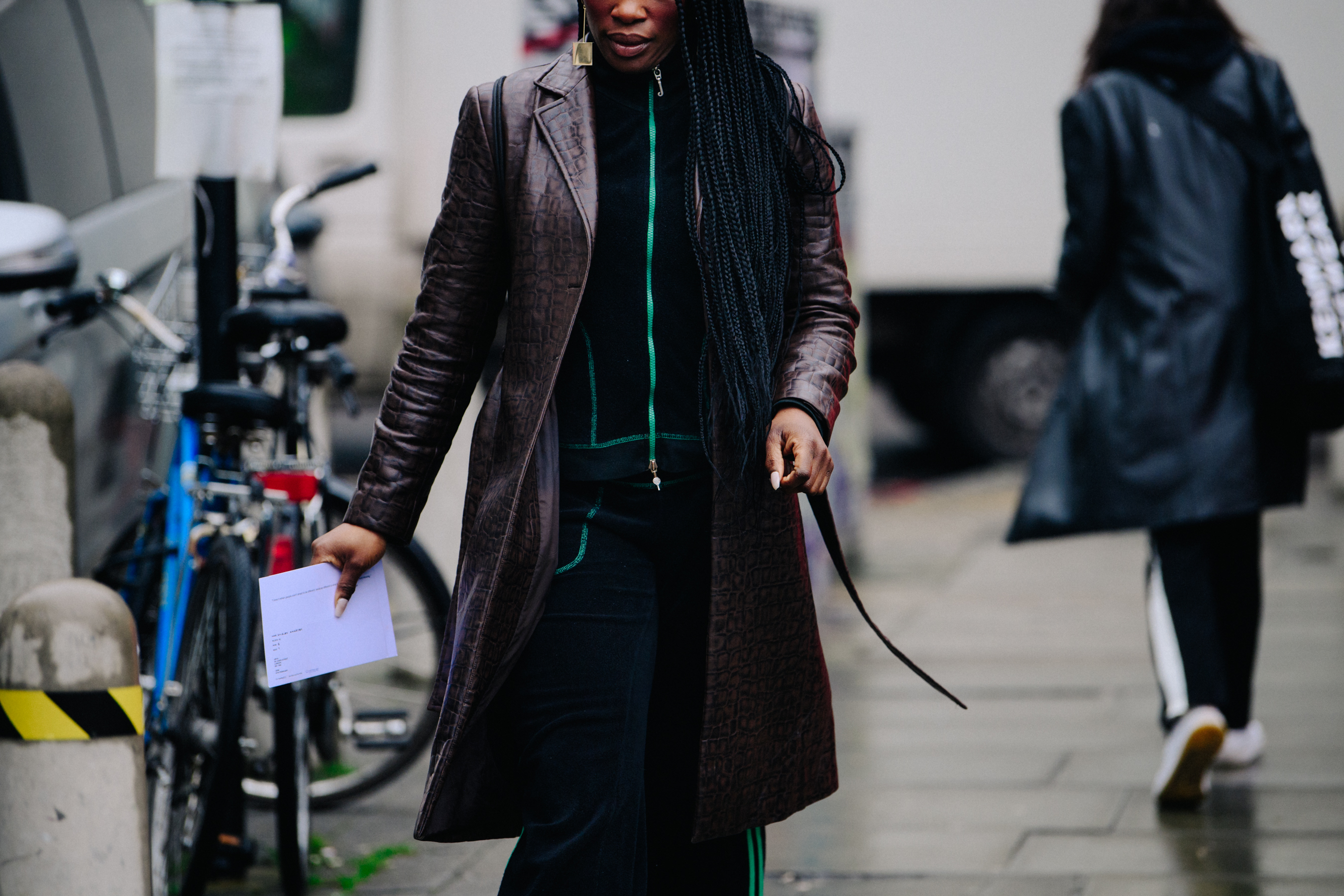 Woman wearing long snakeskin coat