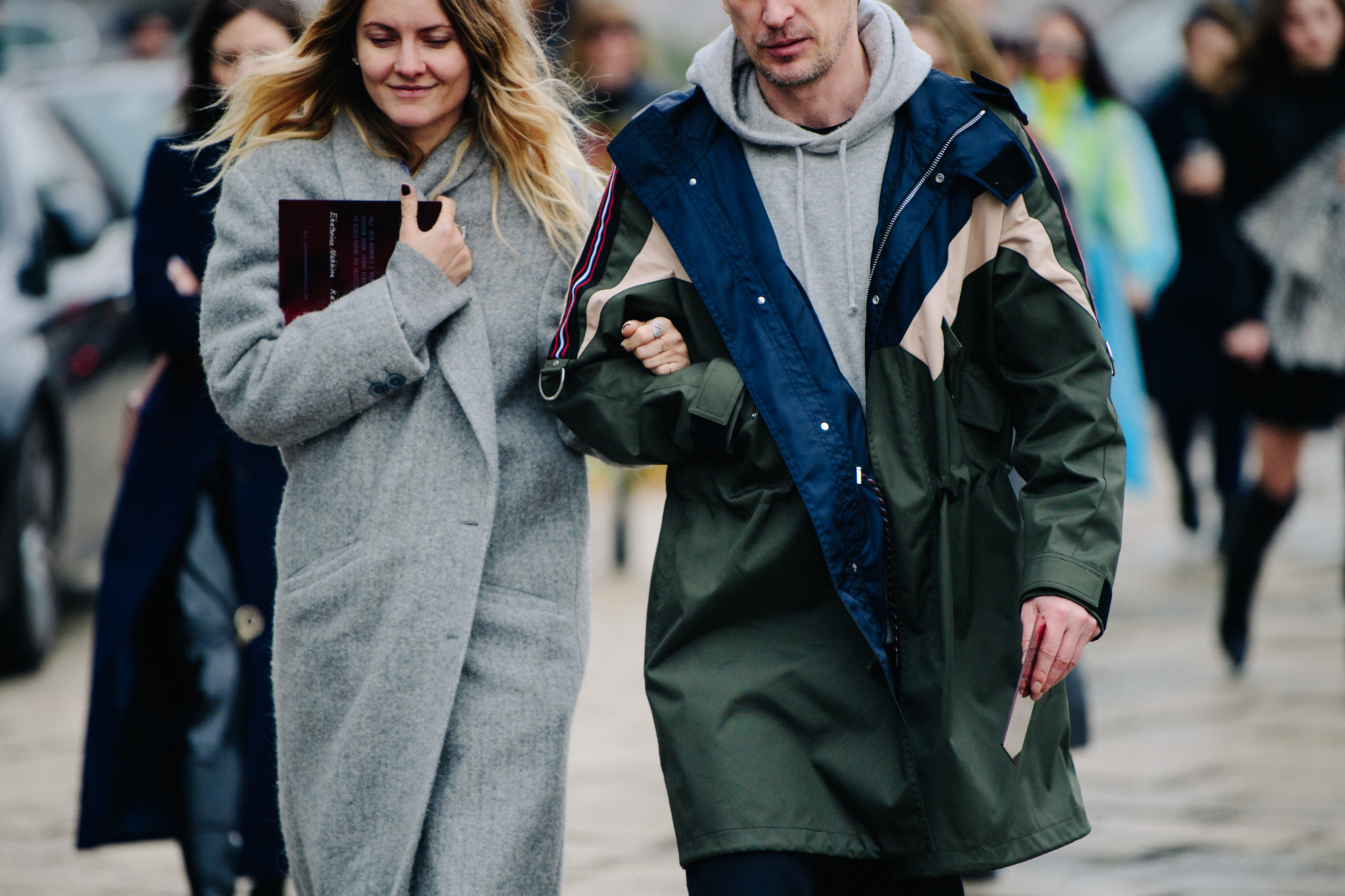 Couple wearing grey outerwear