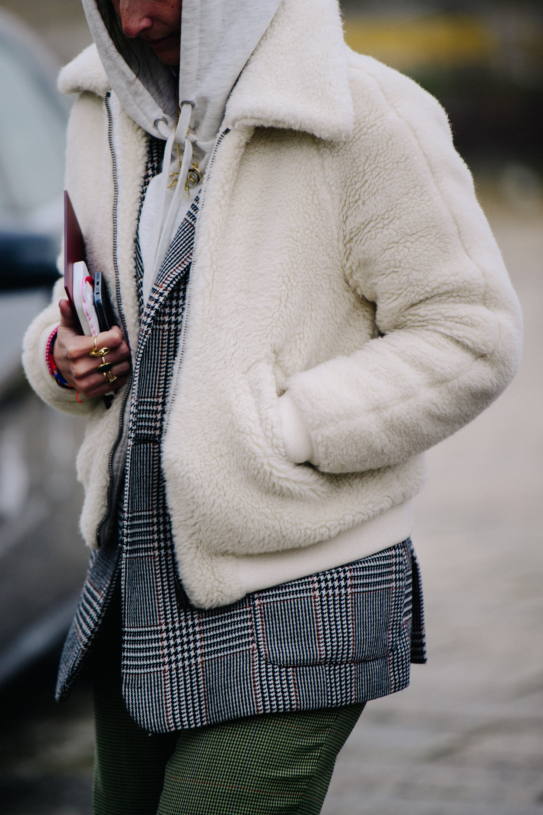 Woman wearing white fur coat