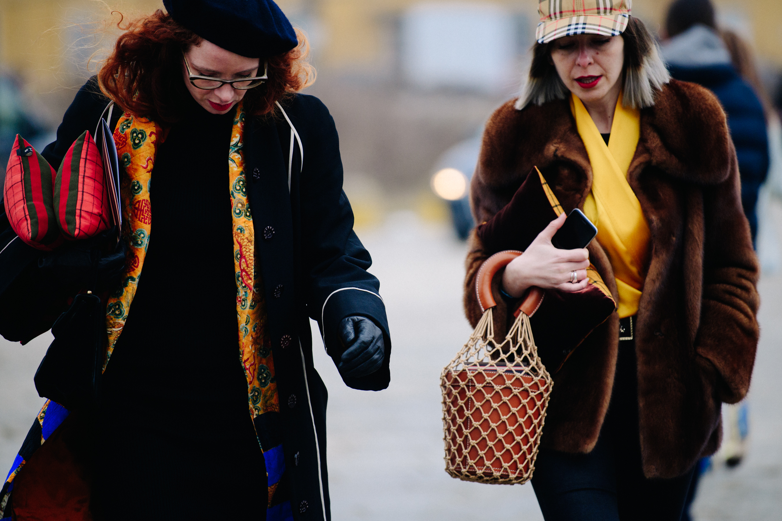 Two women wearing dark jackets