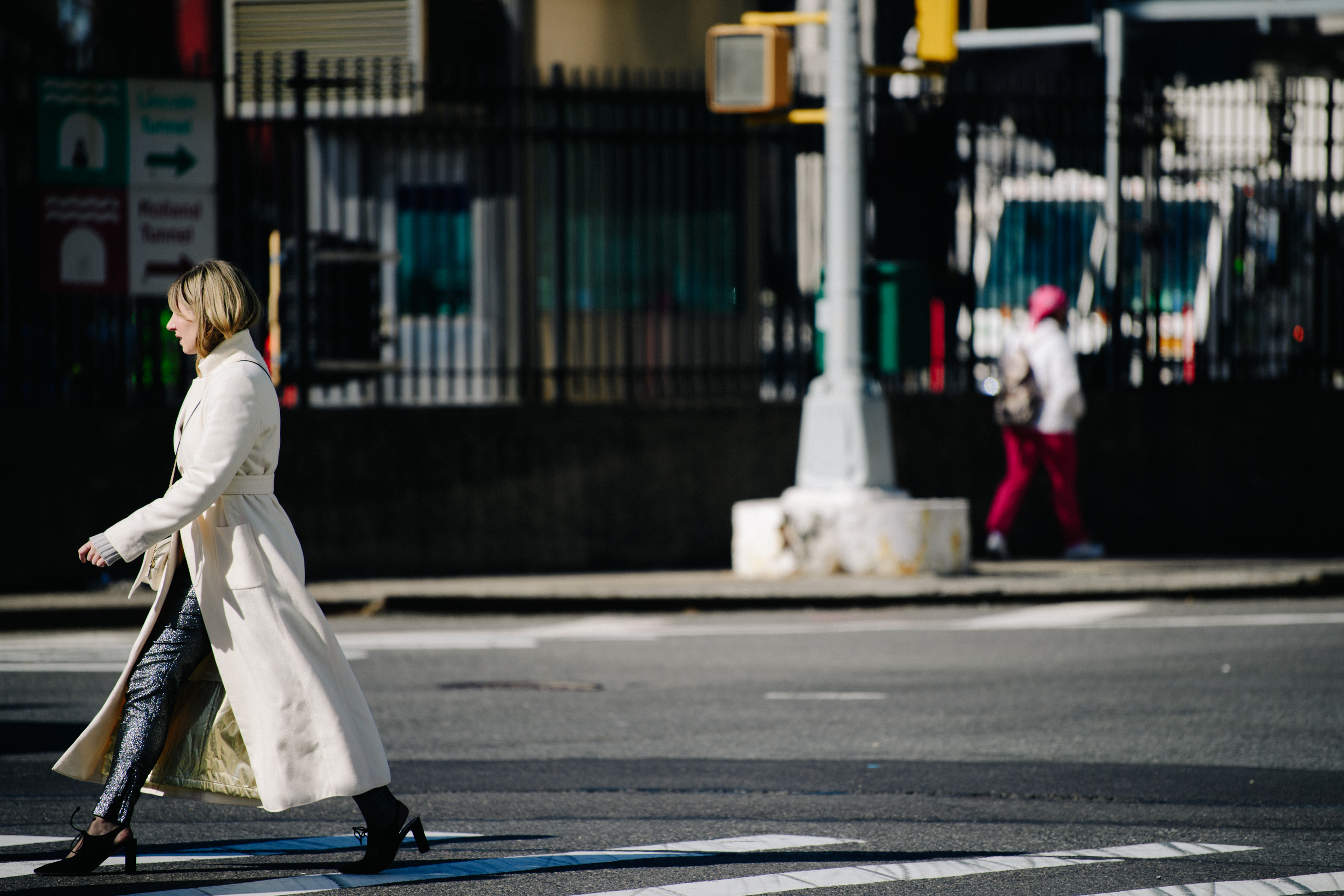 Woman wearing long white coat