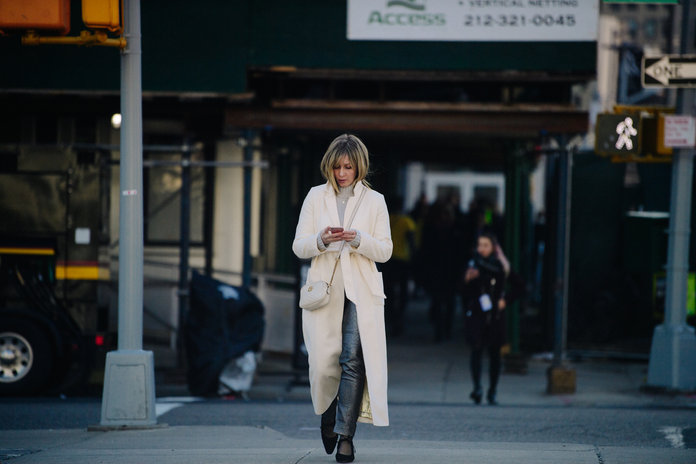 Woman wearing long white coat