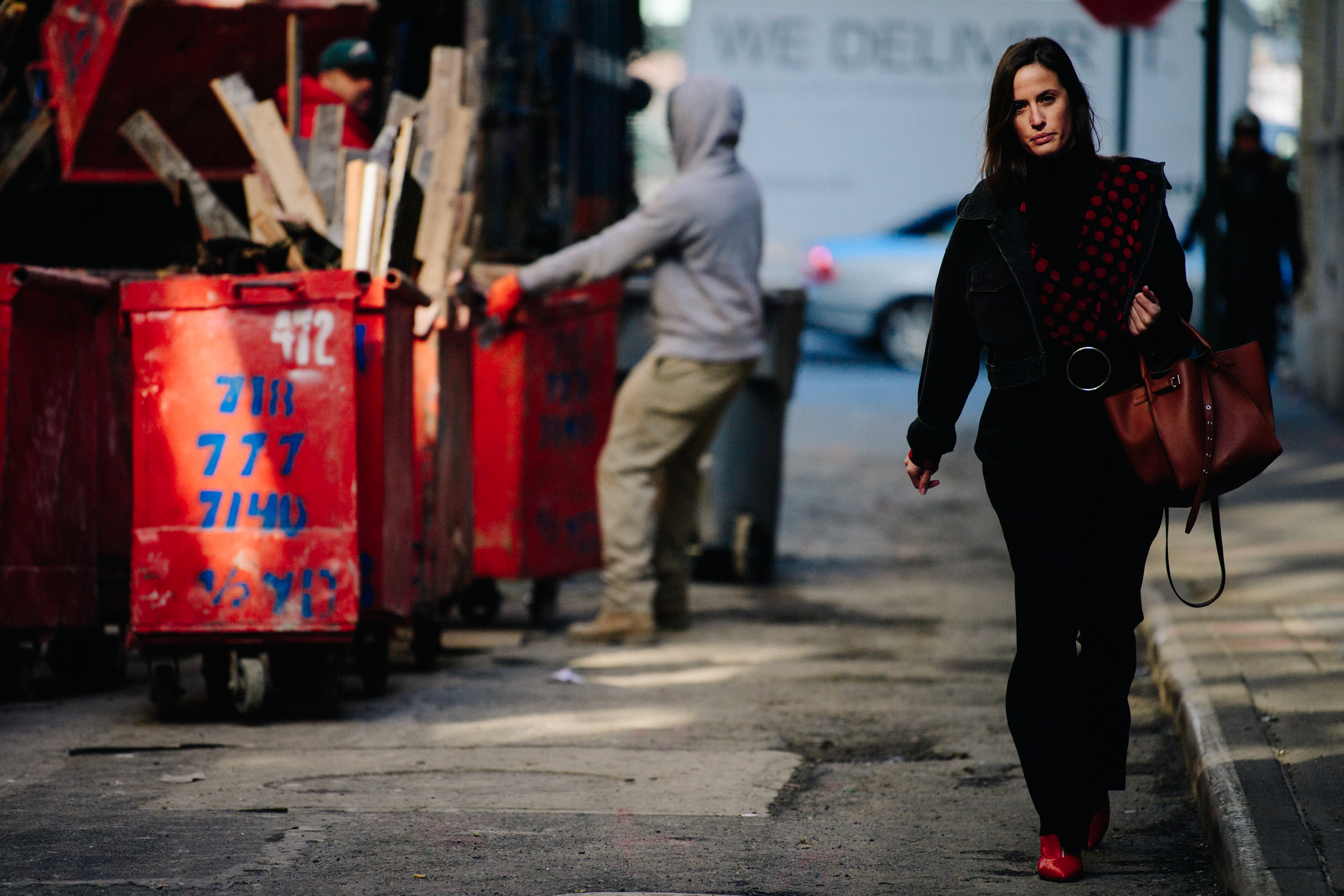 Woman wearing red spotted top