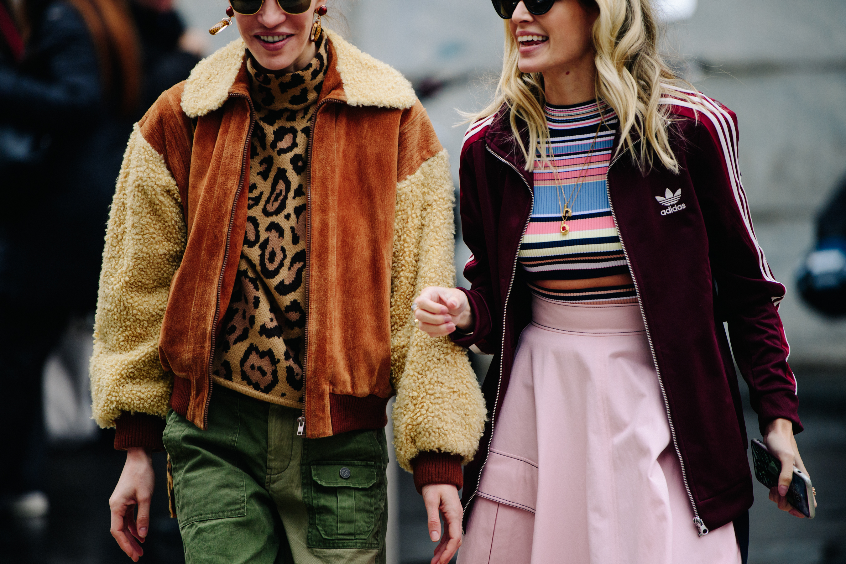 Two women wearing light jackets