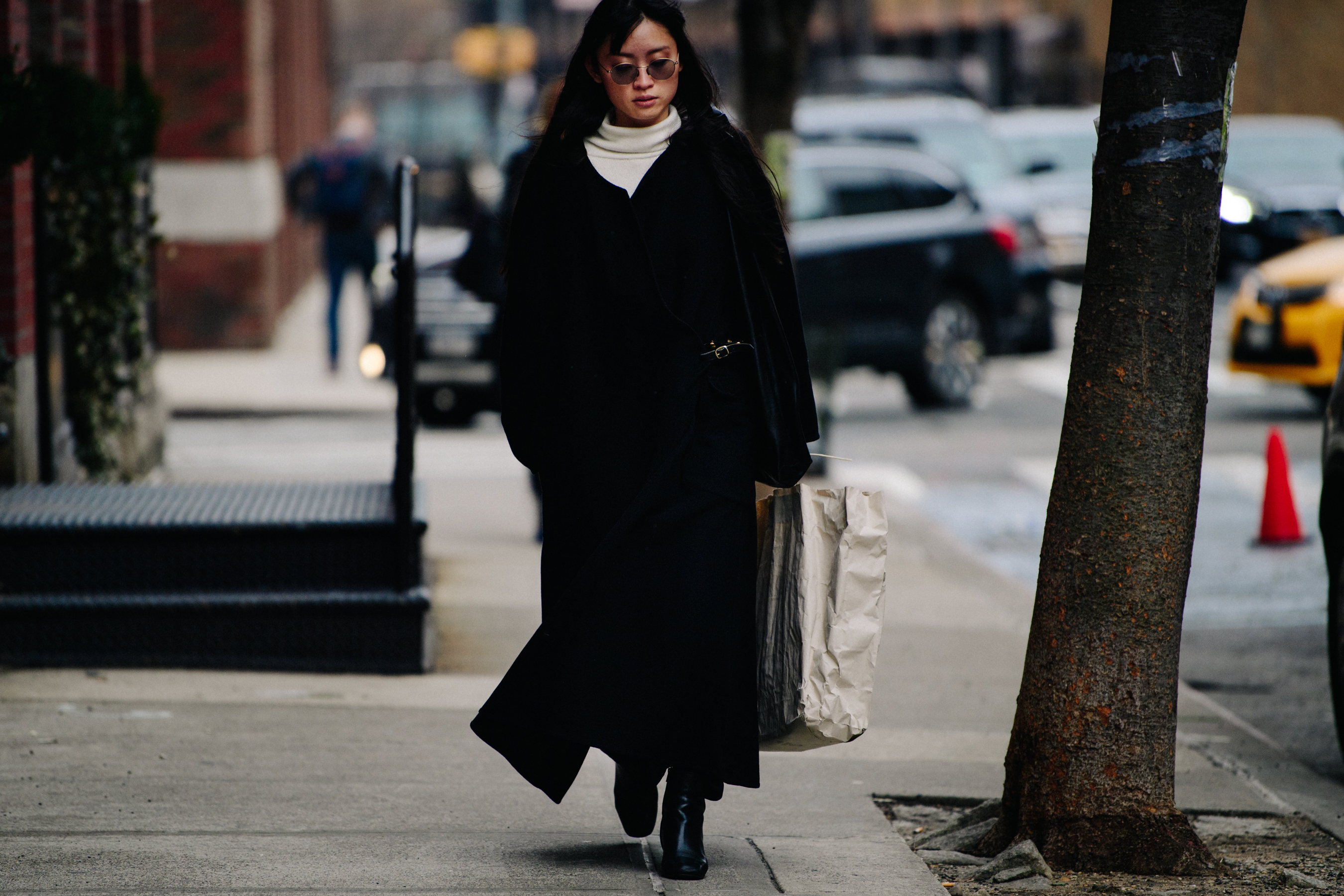 Woman wearing black long coat
