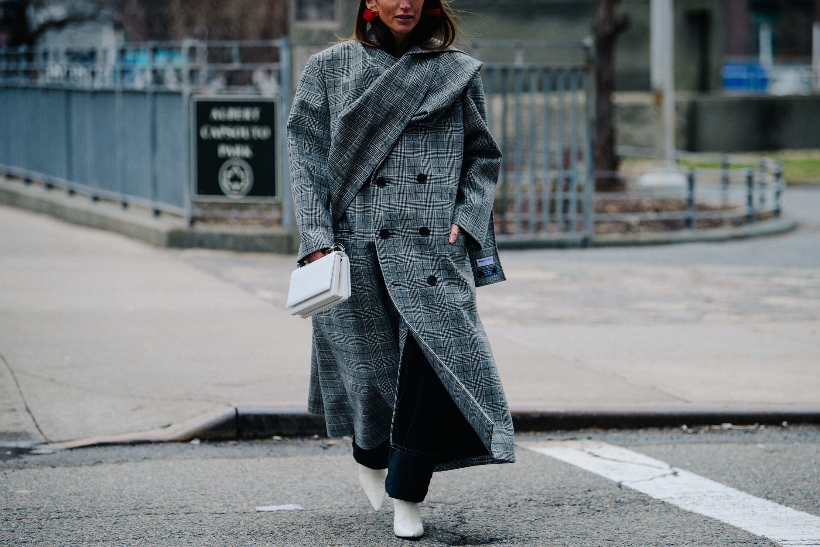 Woman wearing large grey coat