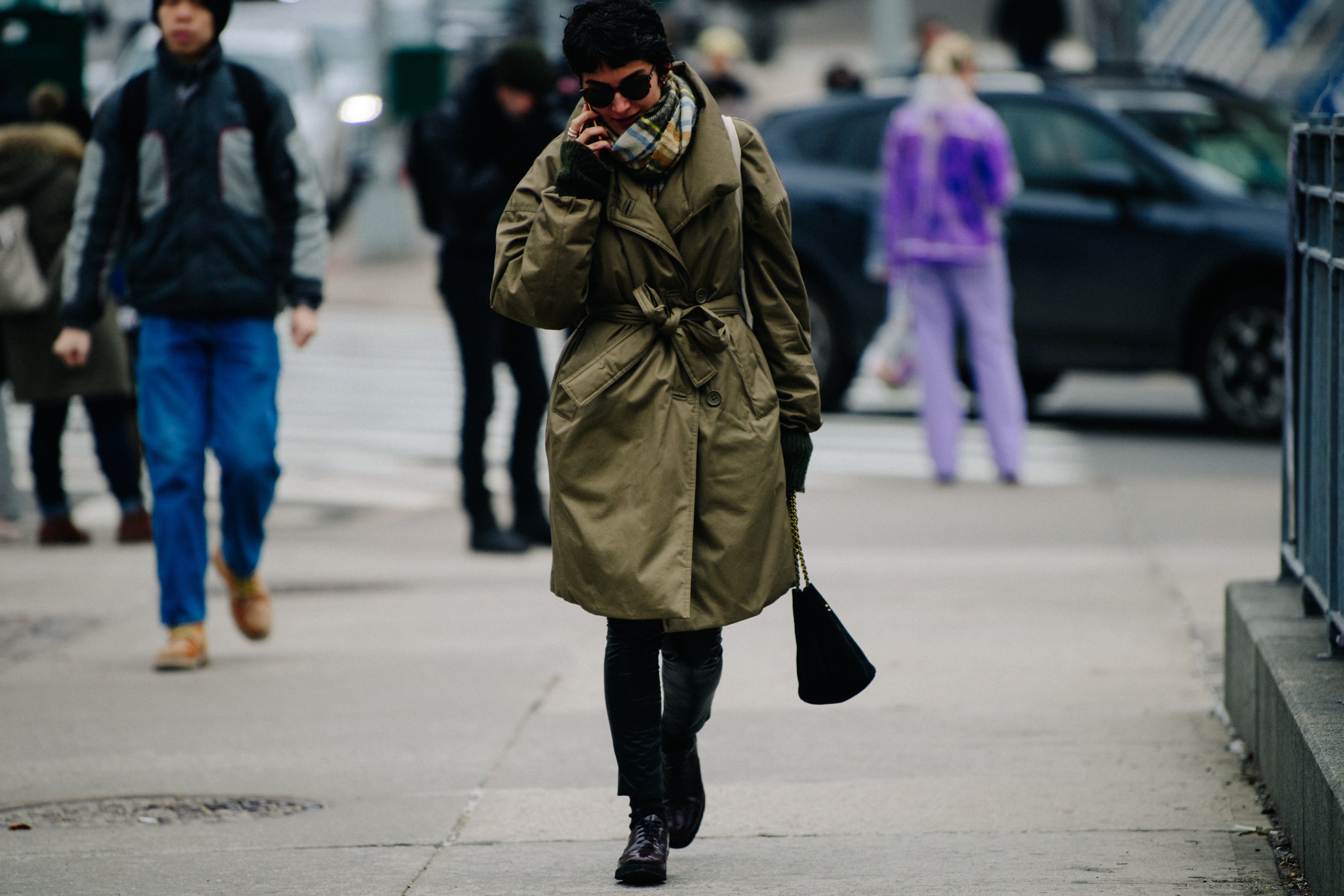 Woman wearing belted green coat