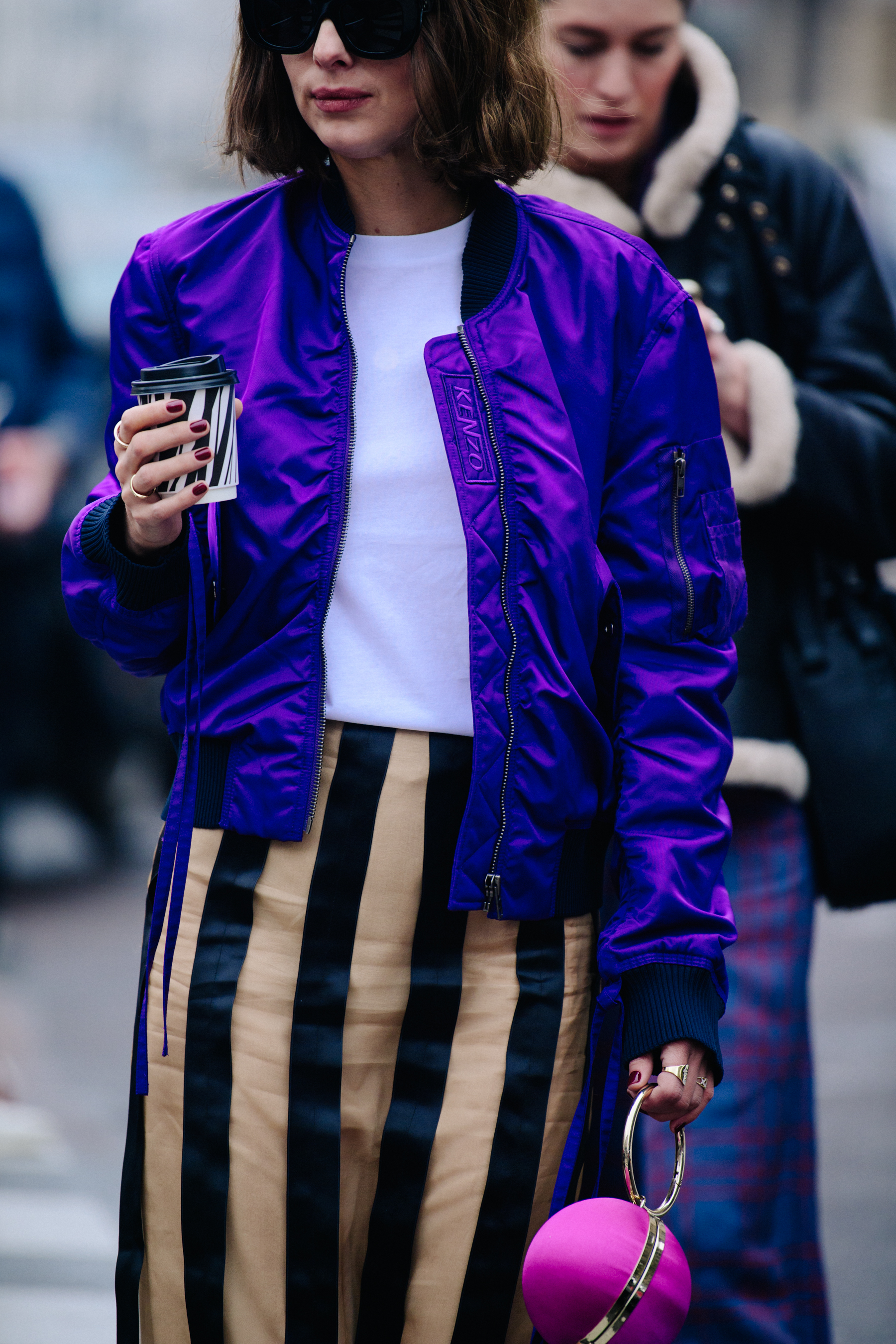Woman wearing Kenzo bomber jacket