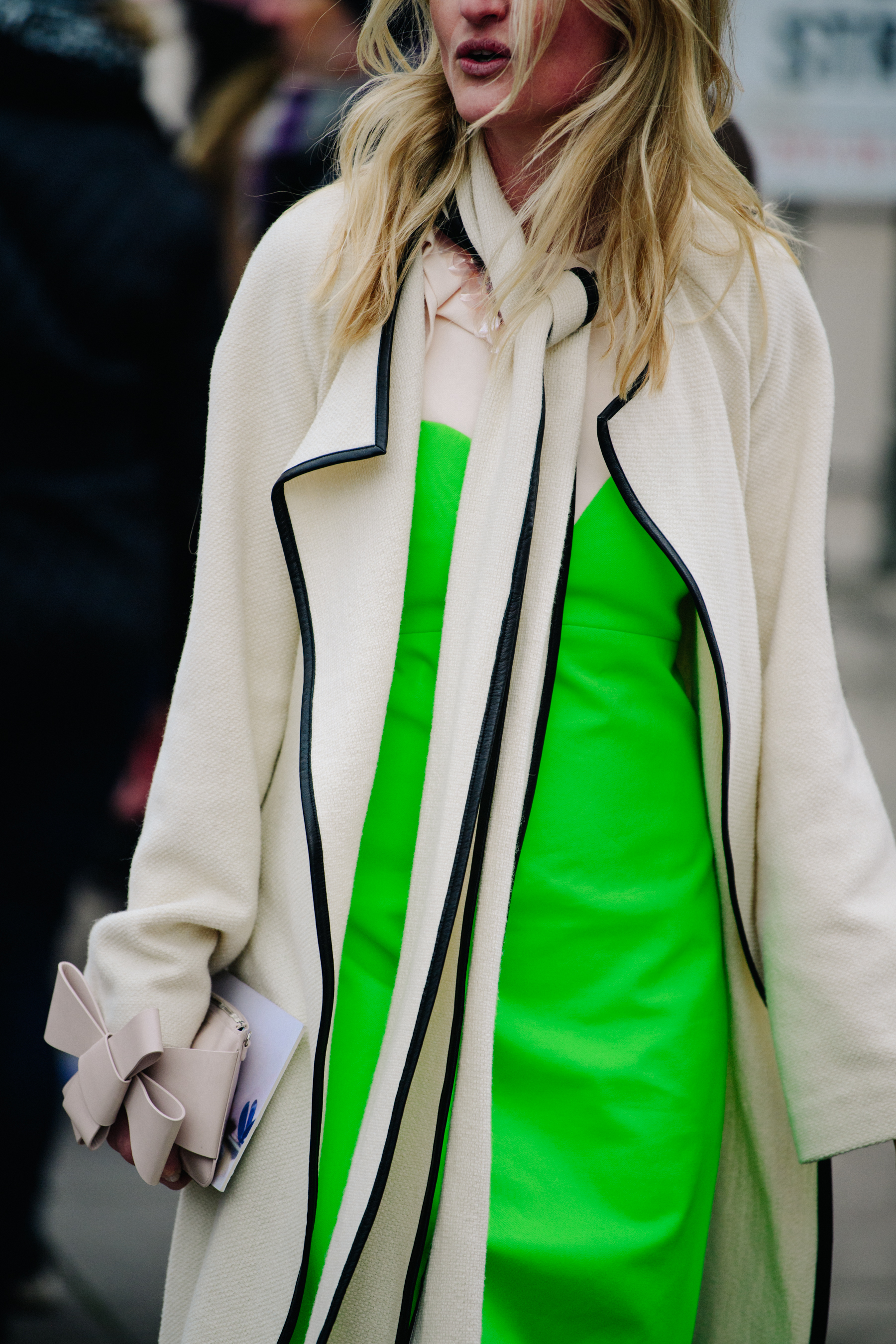 Woman wearing green and white coat