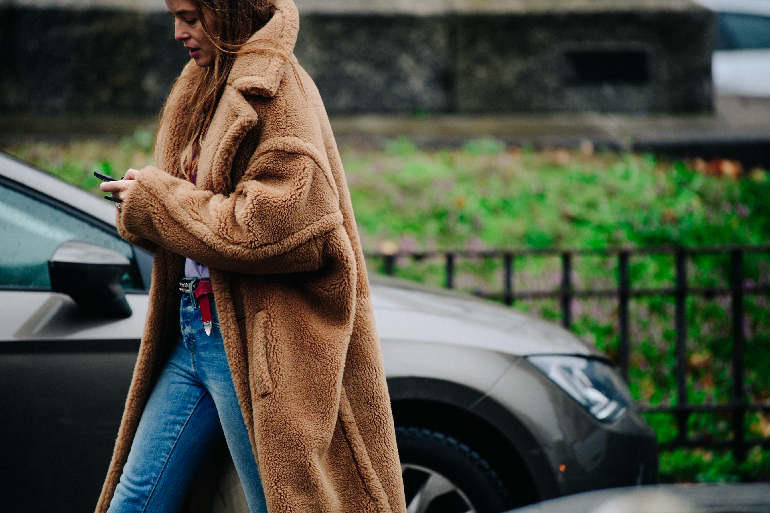 Woman wearing long brown fur coat