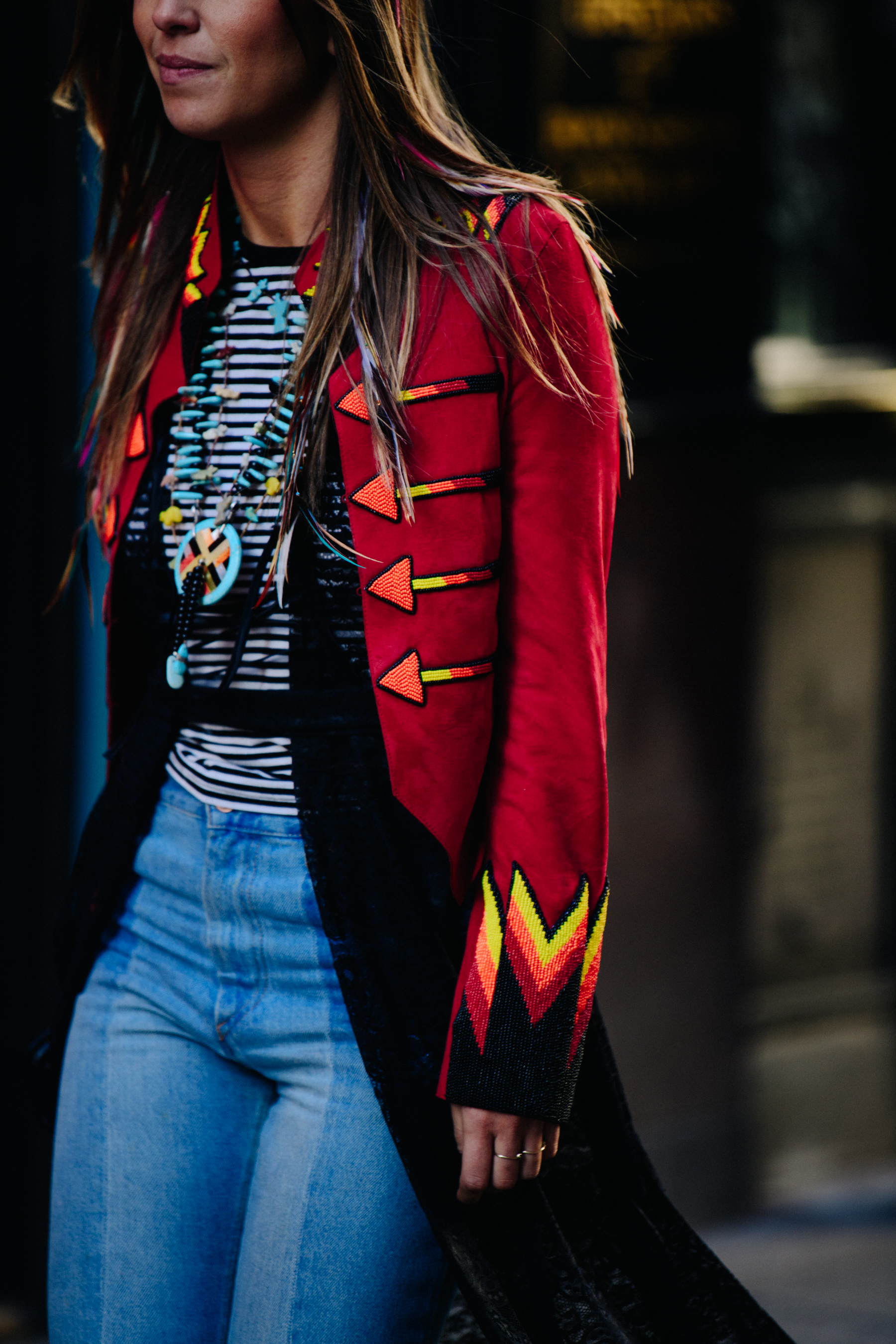 Woman wearing red and sequin coat