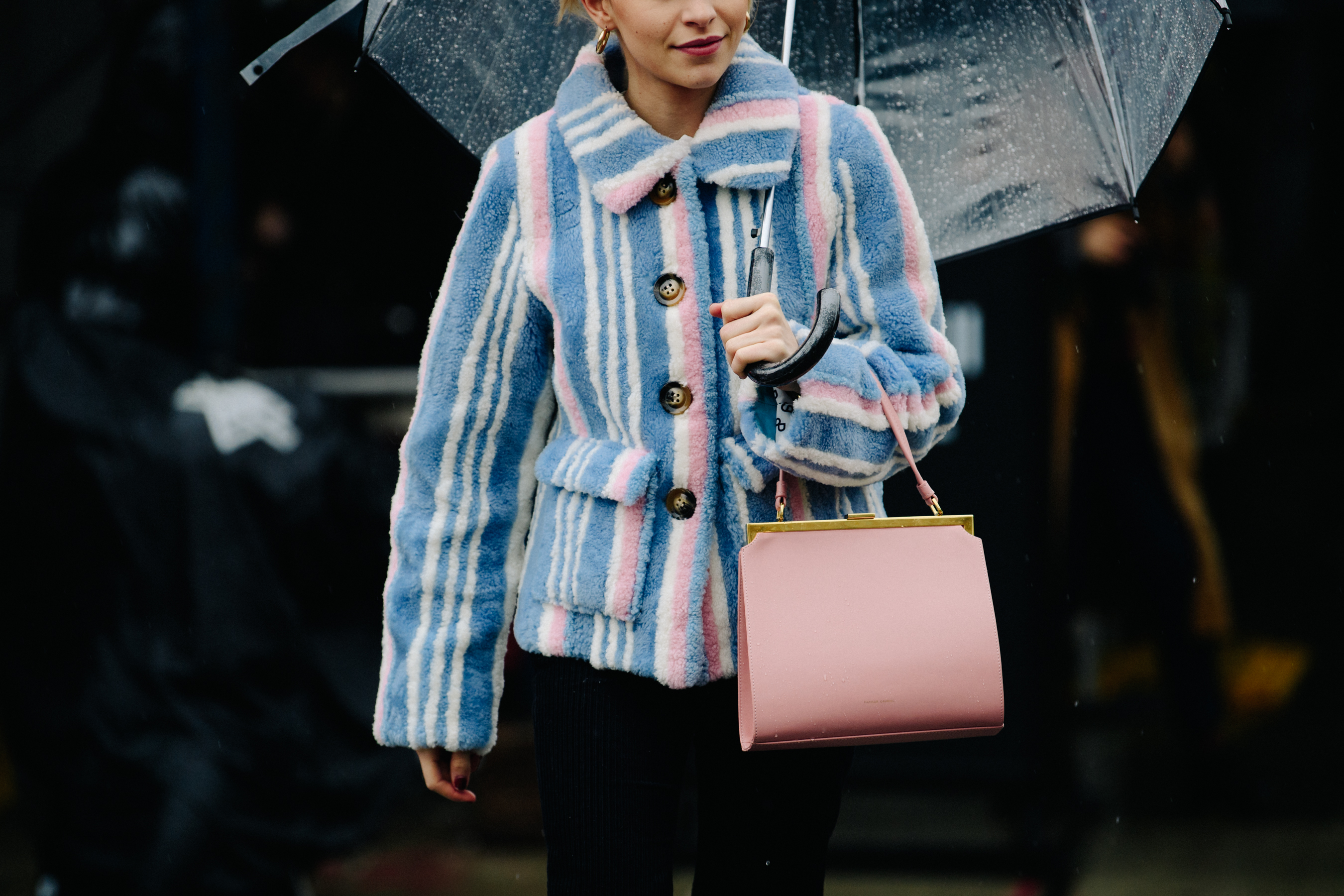 German blogger holding umbrella