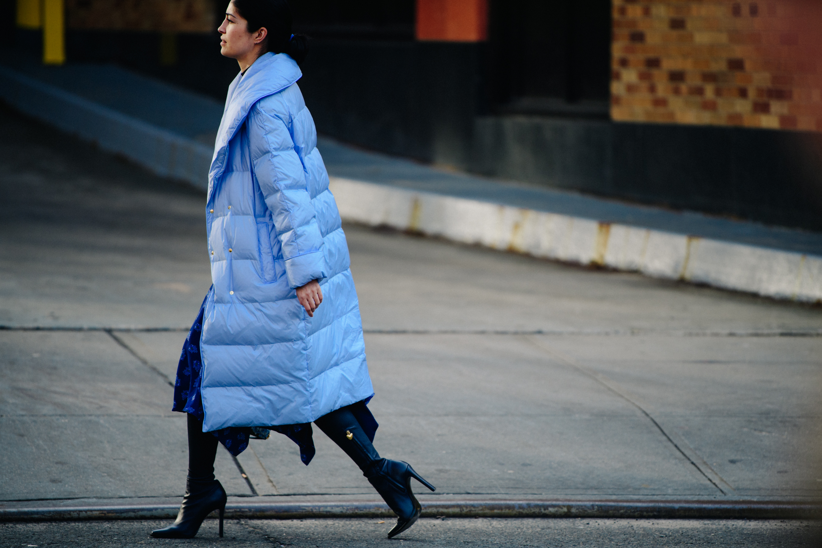 Woman wearing long blue coat