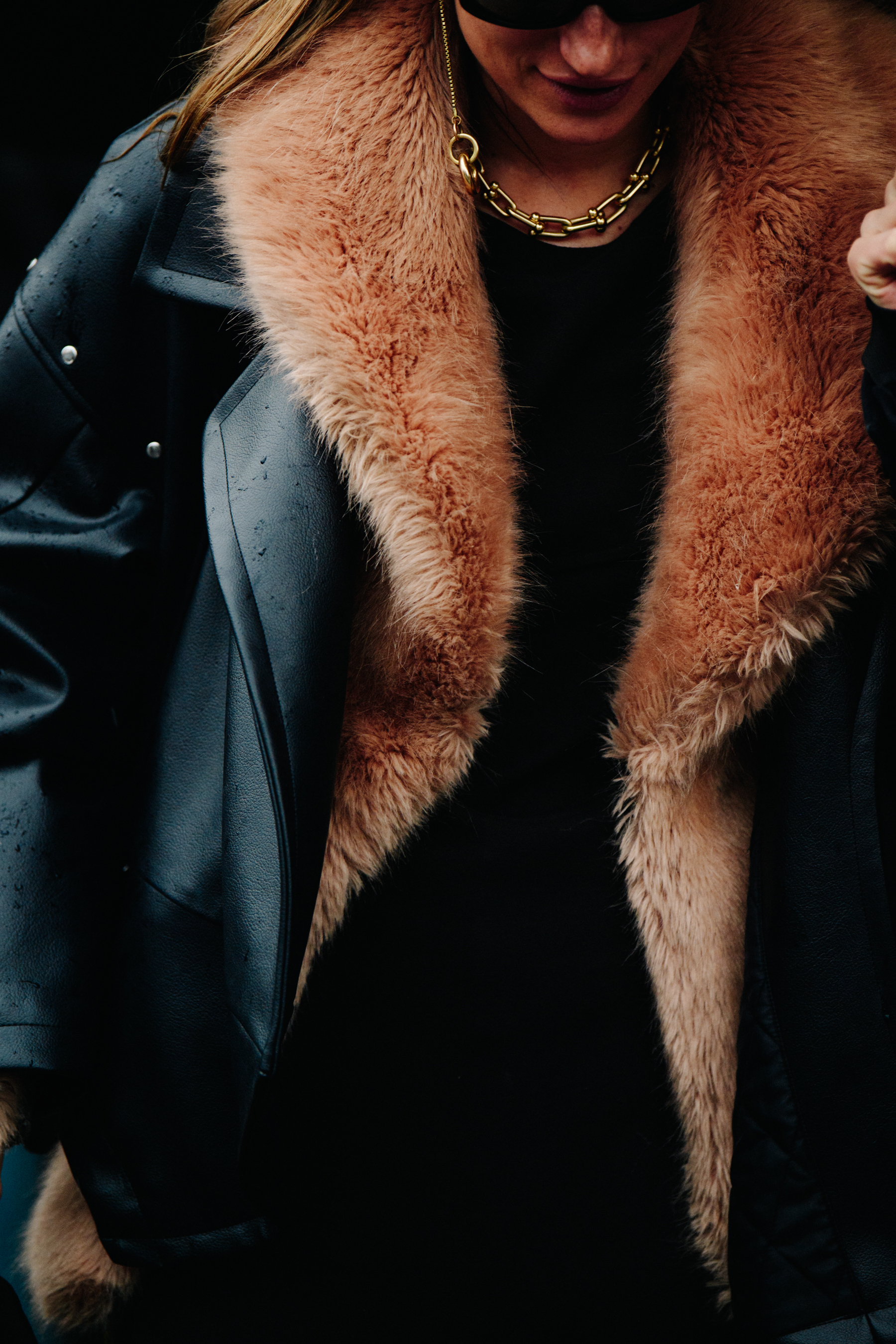 Woman wearing fur collar jacket